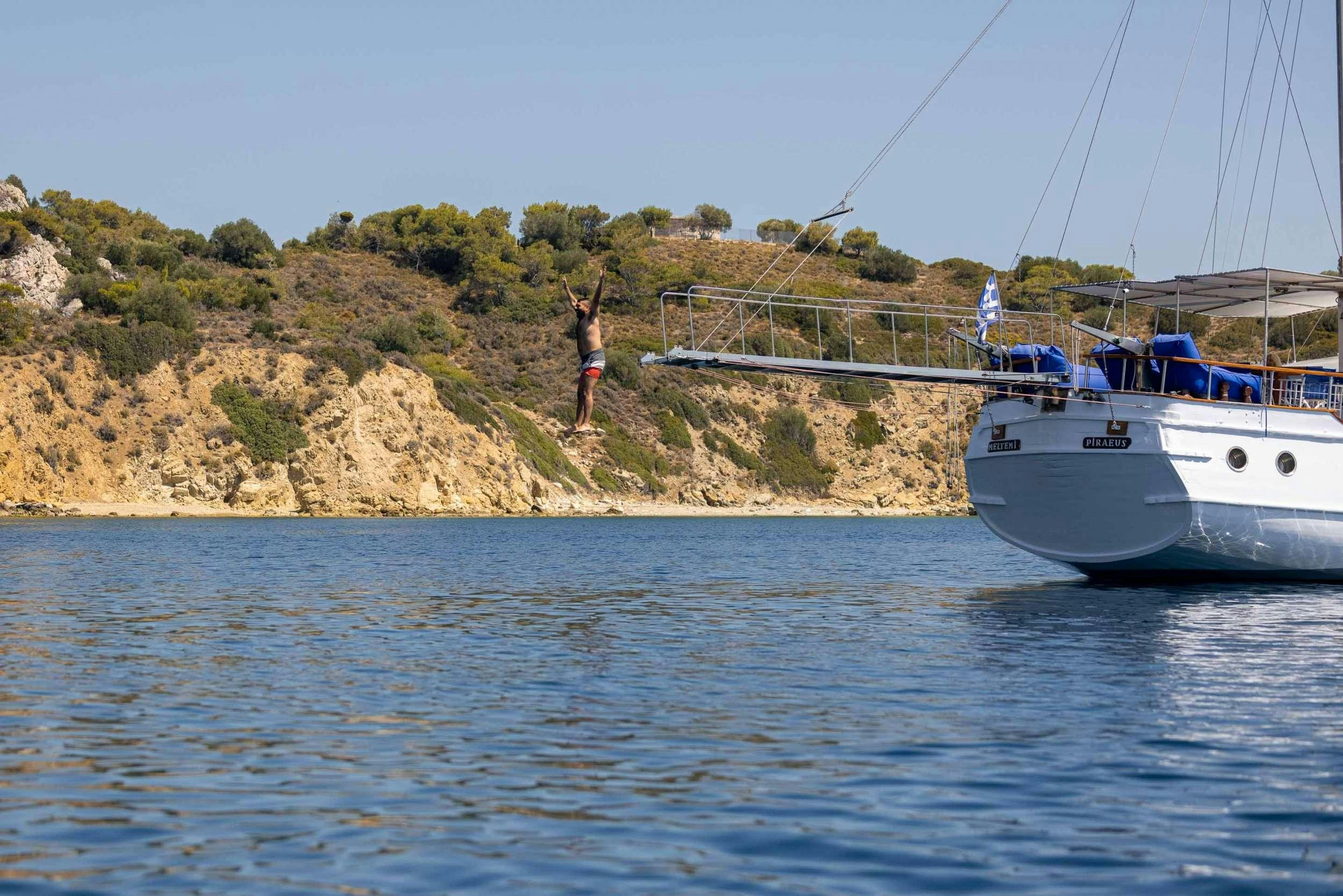 a person standing on a dock aboard MELTEMI Yacht for Charter
