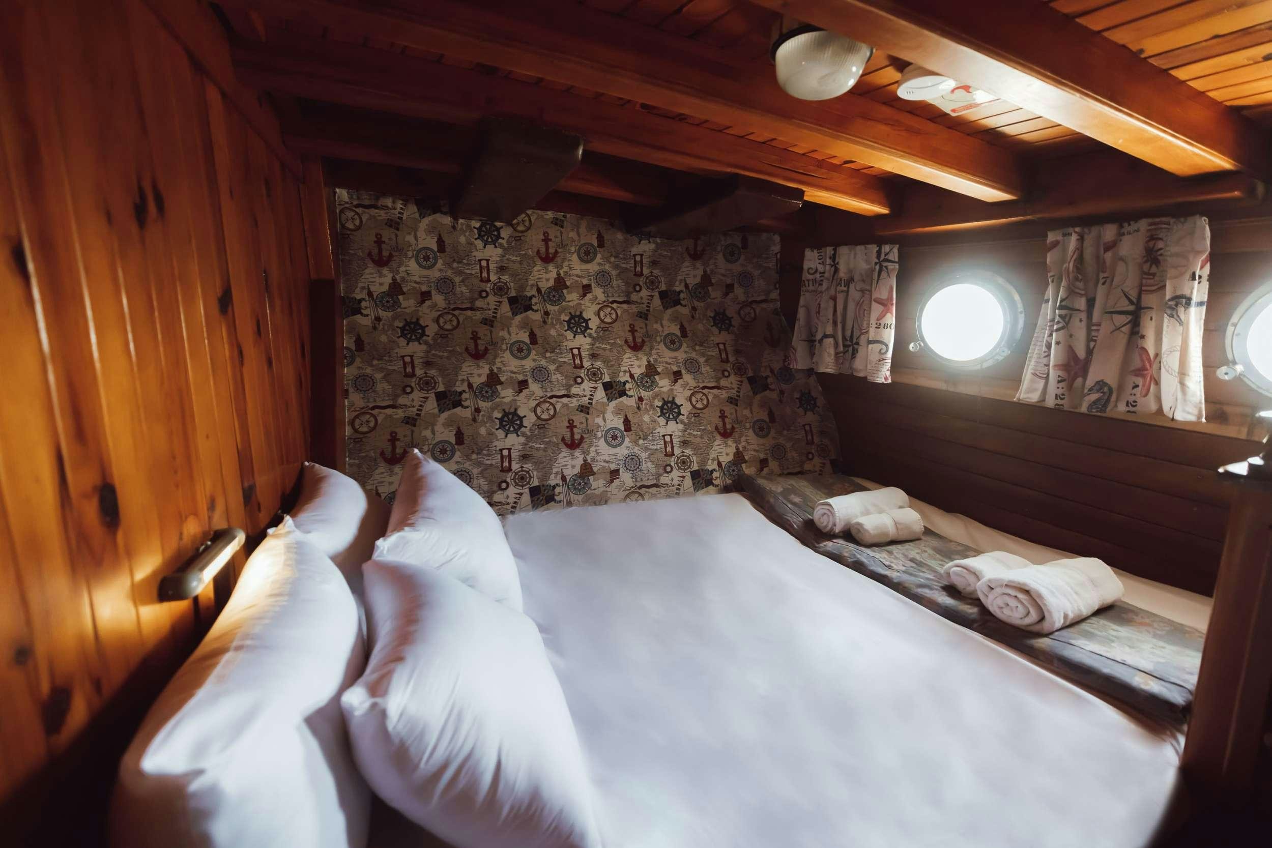 a person lying on a bed aboard MELTEMI Yacht for Charter