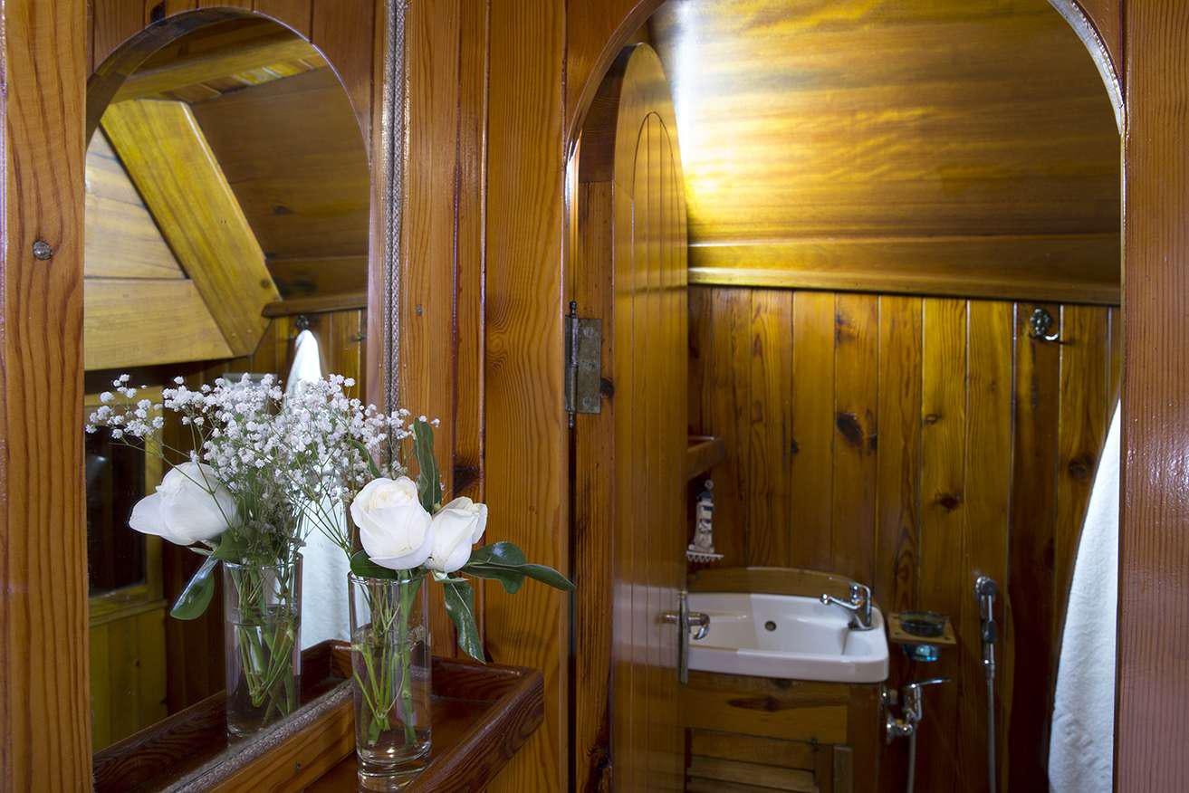 a vase of flowers sits on a table aboard MELTEMI Yacht for Charter