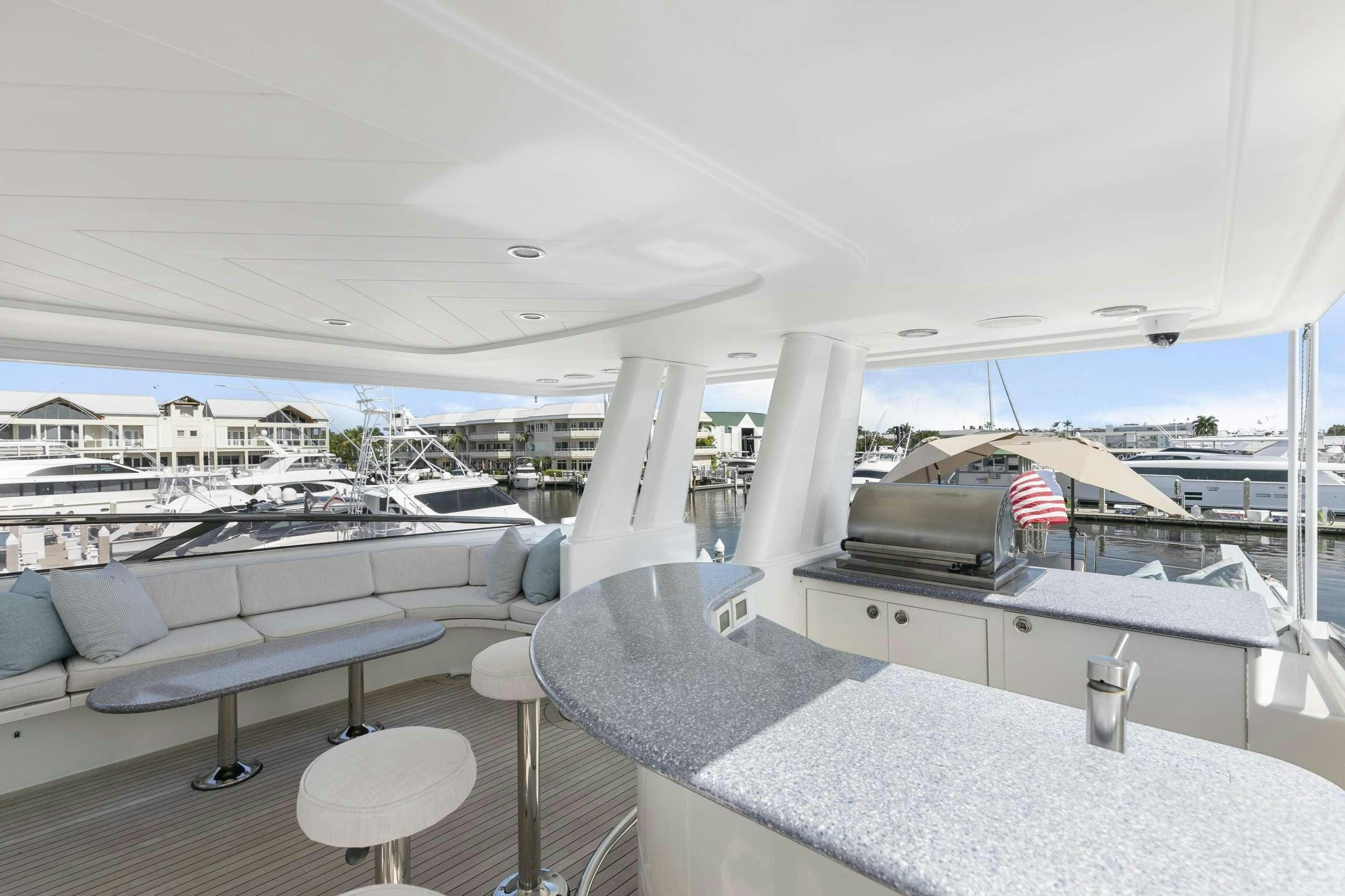 a large room with a table and chairs aboard EDEN Yacht for Charter