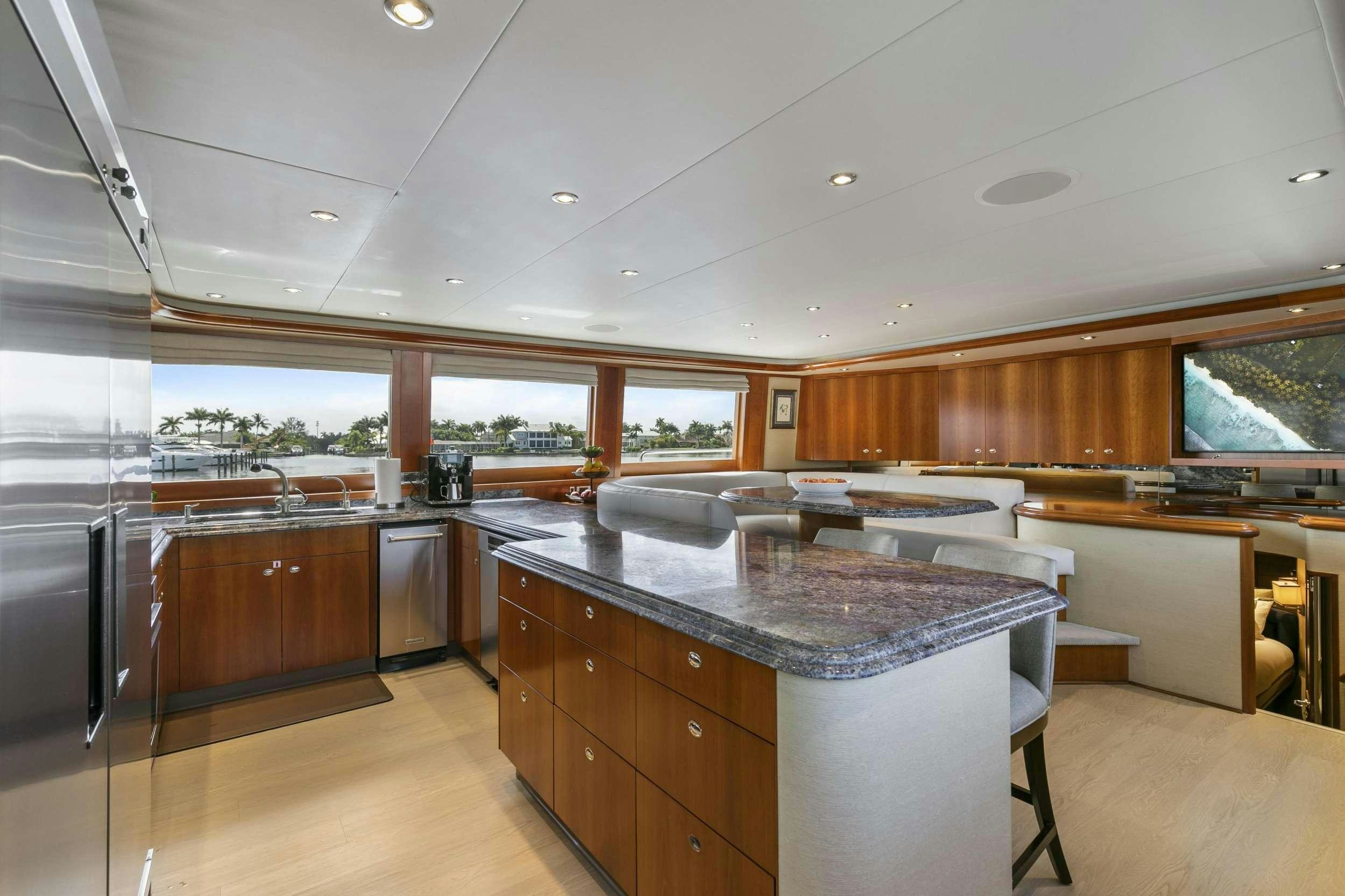 a kitchen with a large island aboard EDEN Yacht for Charter