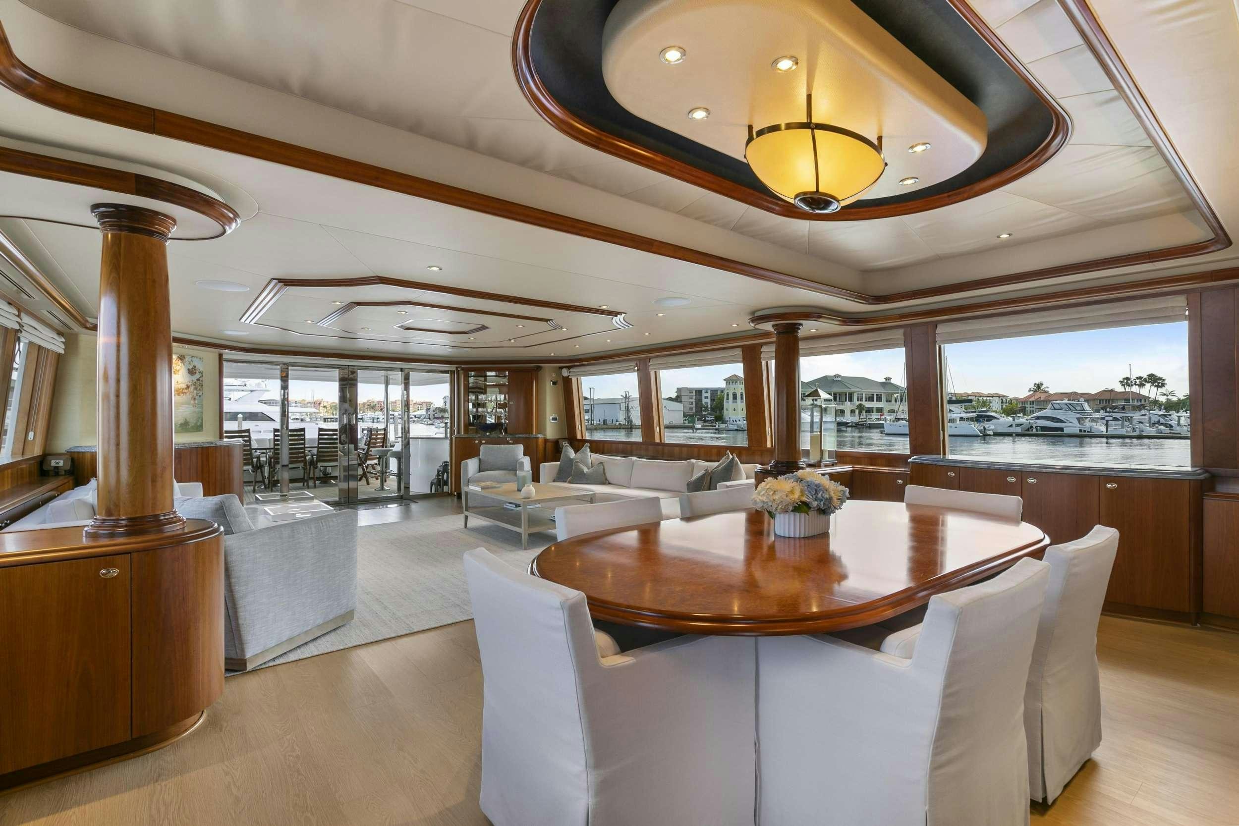 a room with a table and chairs aboard EDEN Yacht for Charter
