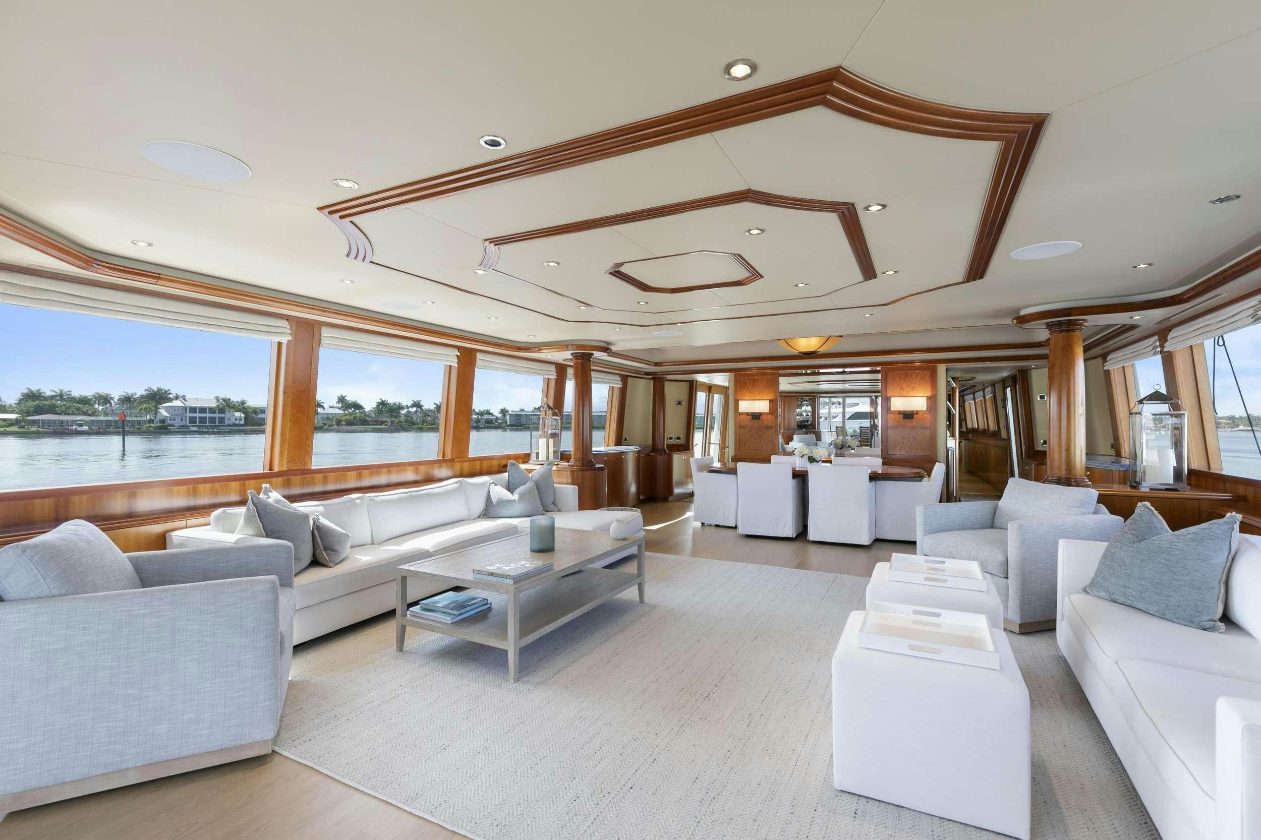 a living room with a large open window aboard EDEN Yacht for Charter