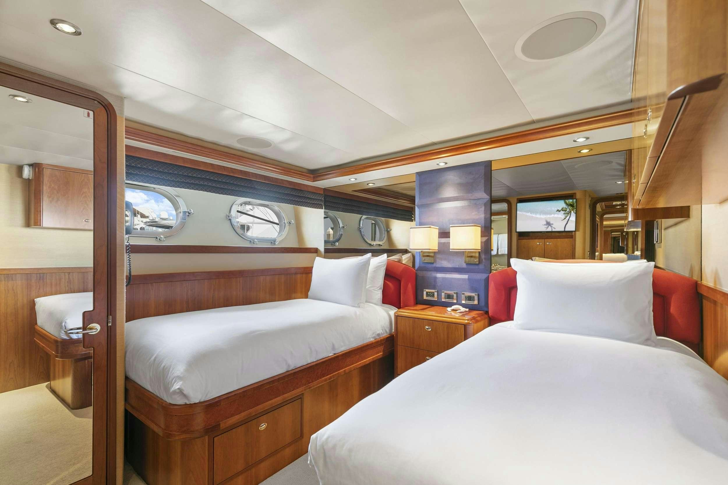 a room with two beds aboard EDEN Yacht for Charter