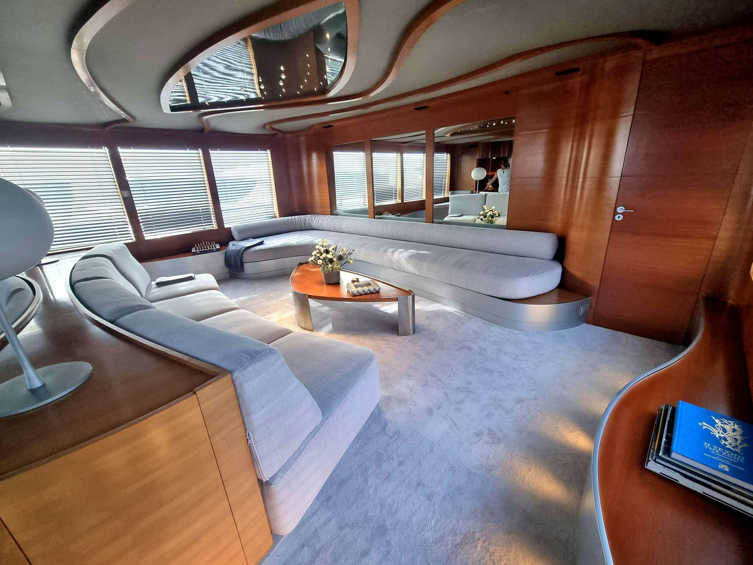 a room with a couch and a table aboard SATORI Yacht for Charter