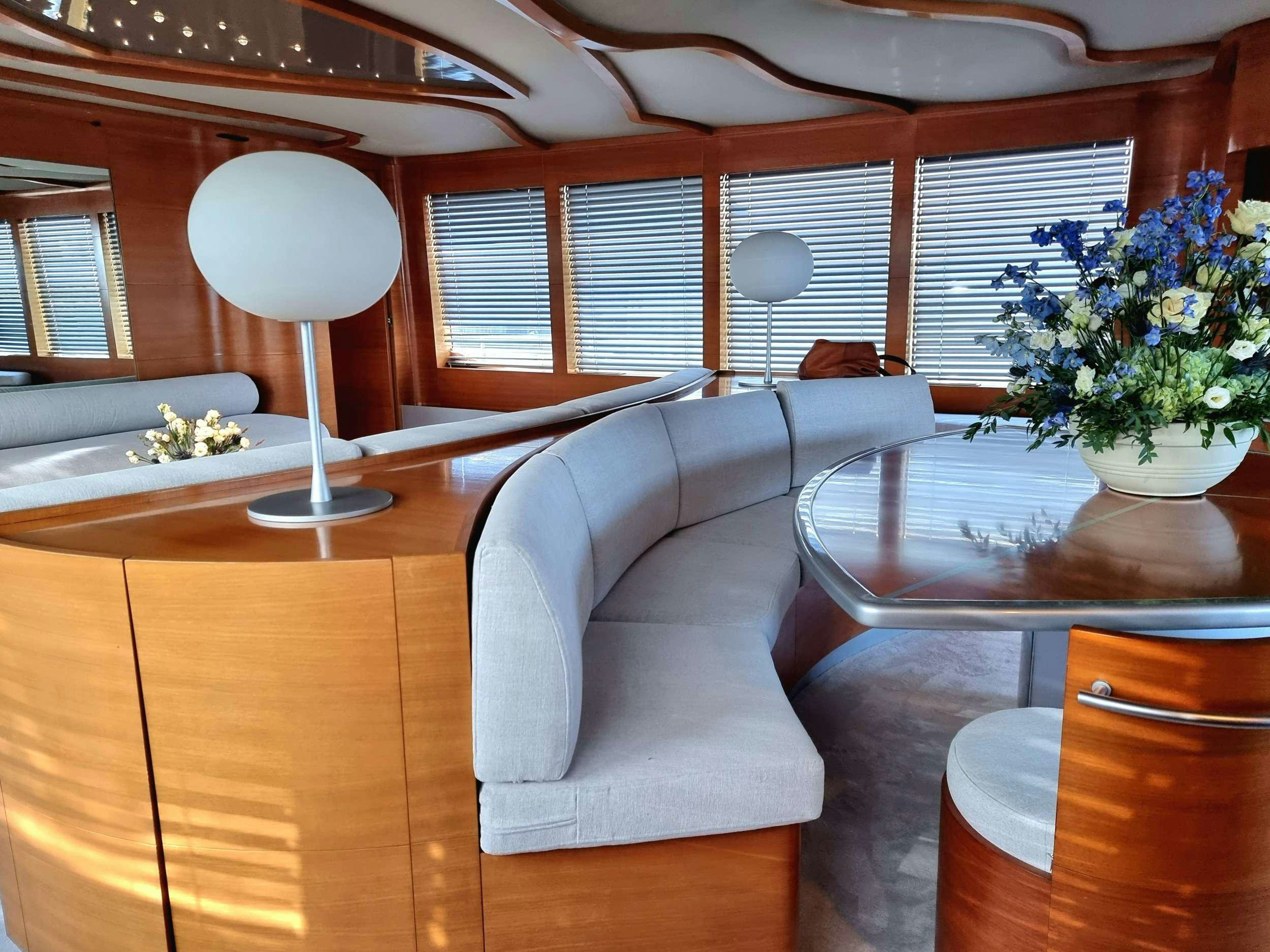 a room with a couch and a table aboard SATORI Yacht for Charter