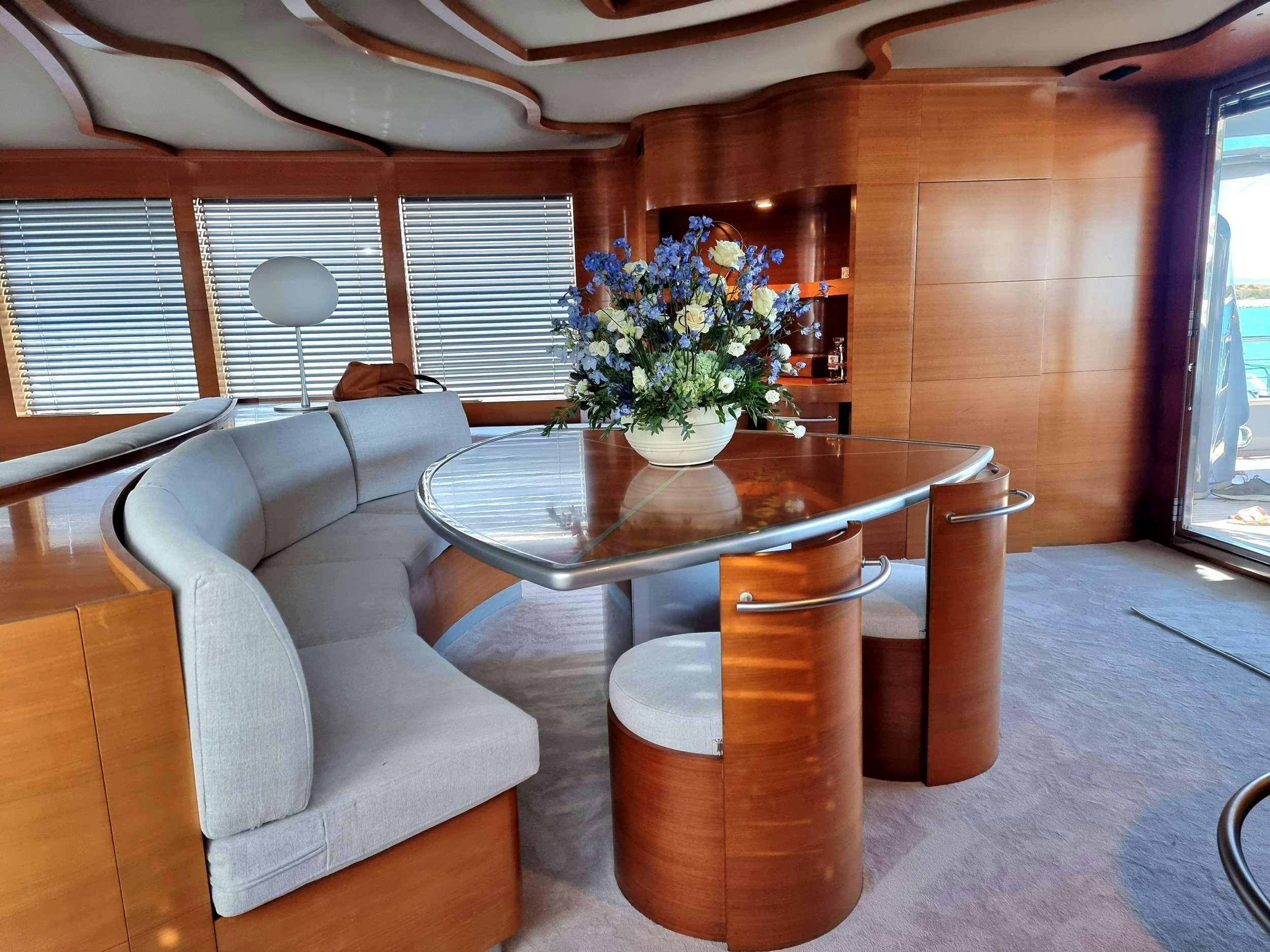 a table and chairs in a room aboard SATORI Yacht for Charter