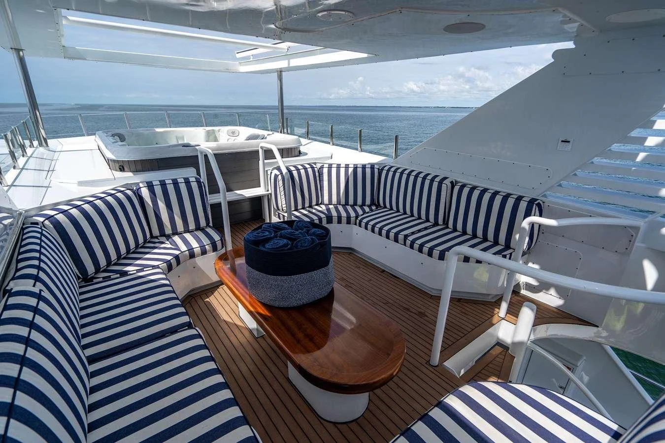 a boat with a table and chairs aboard QUANTUM Yacht for Charter