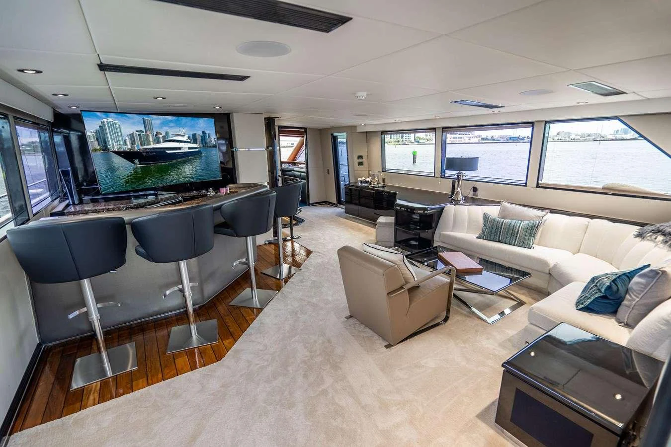a living room with a large screen aboard QUANTUM Yacht for Charter