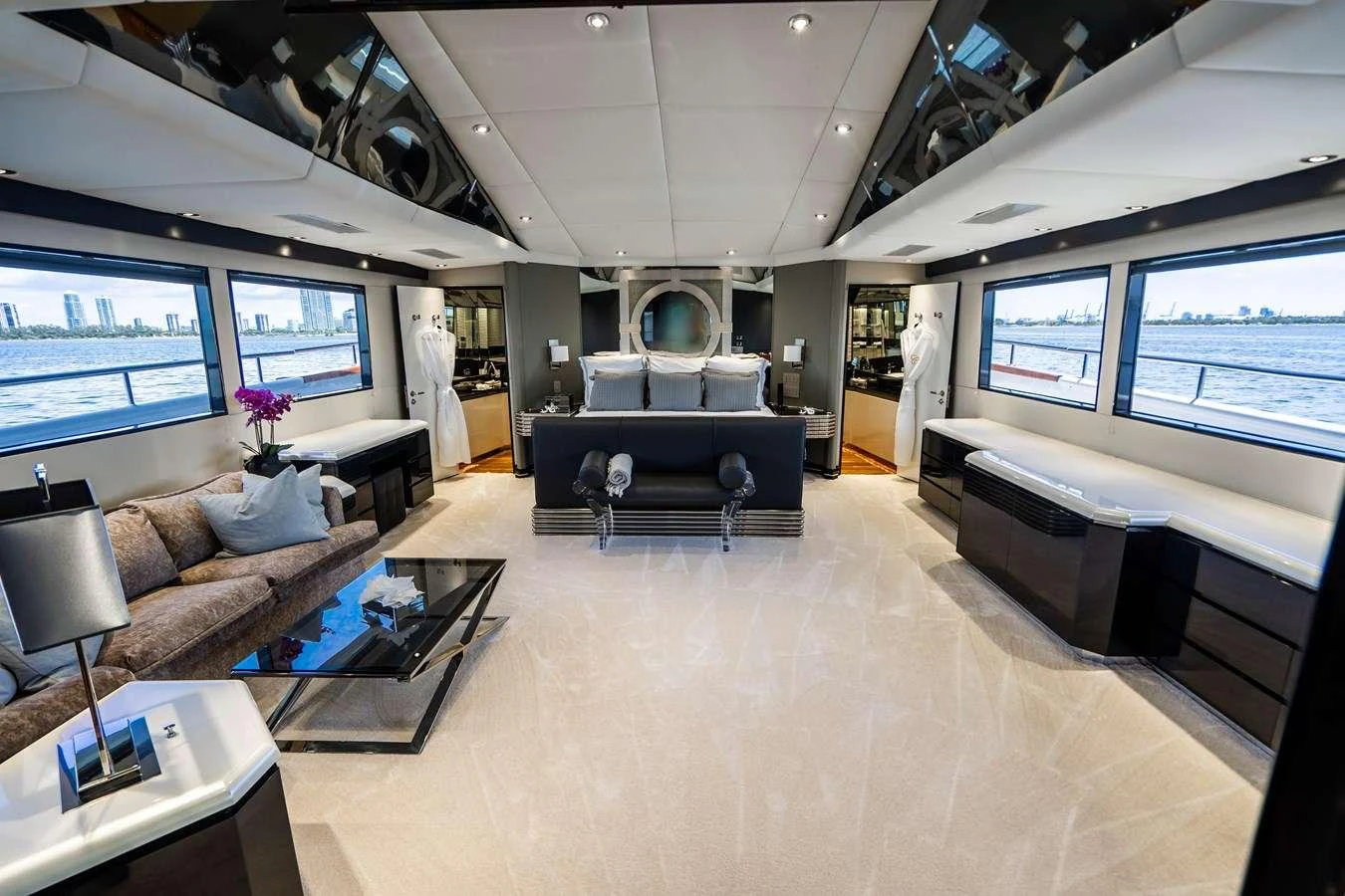 a large living room with a large window aboard QUANTUM Yacht for Charter