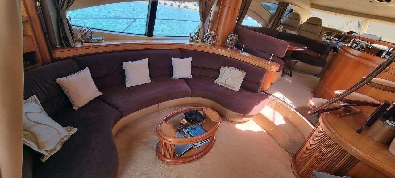 a living room with a leather couch aboard SEA LA VIE Yacht for Charter