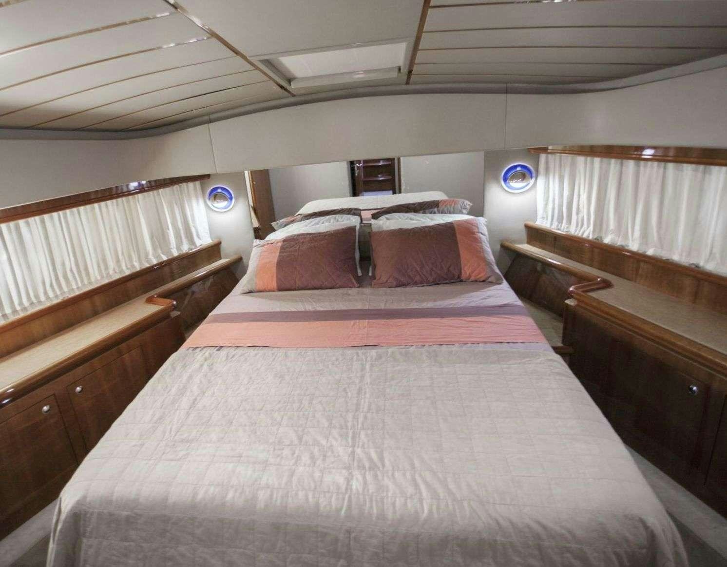 a room with a couple of beds aboard SERENE Yacht for Charter