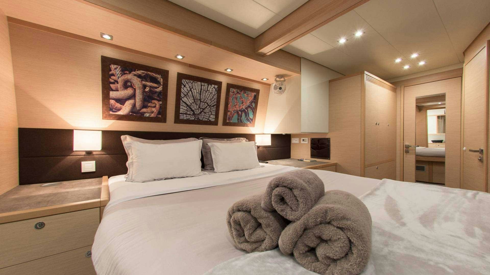 a large bed in a hotel room aboard Alyssa Yacht for Charter