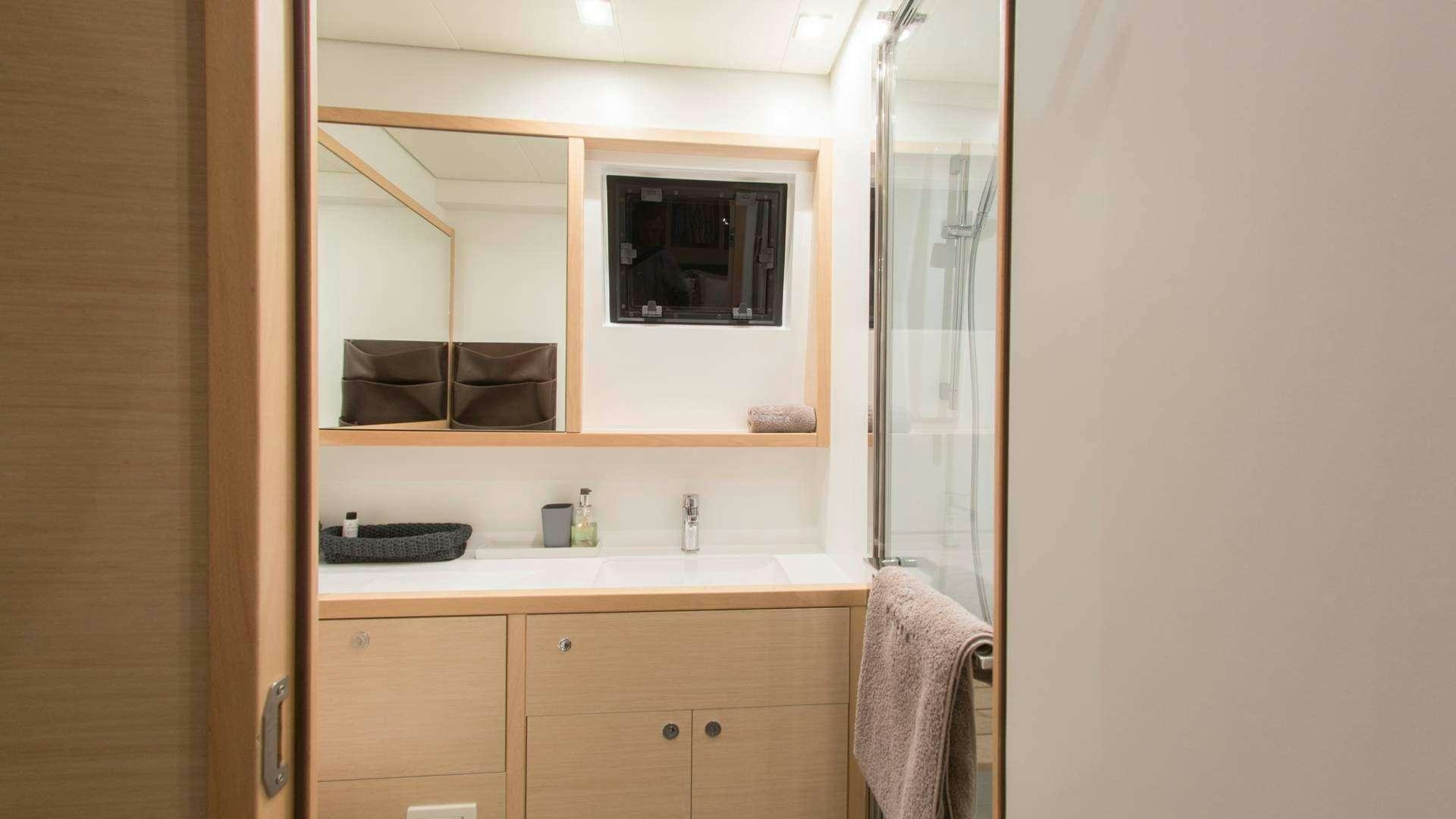 a bathroom with a mirror aboard Alyssa Yacht for Charter