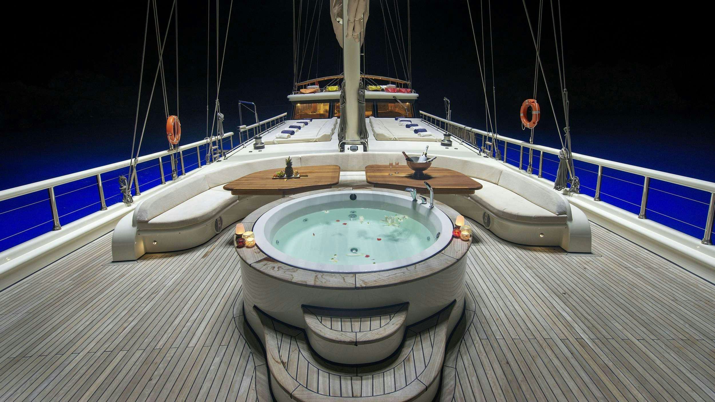 a white and blue water fountain aboard QUEEN OF SALMAKIS Yacht for Charter