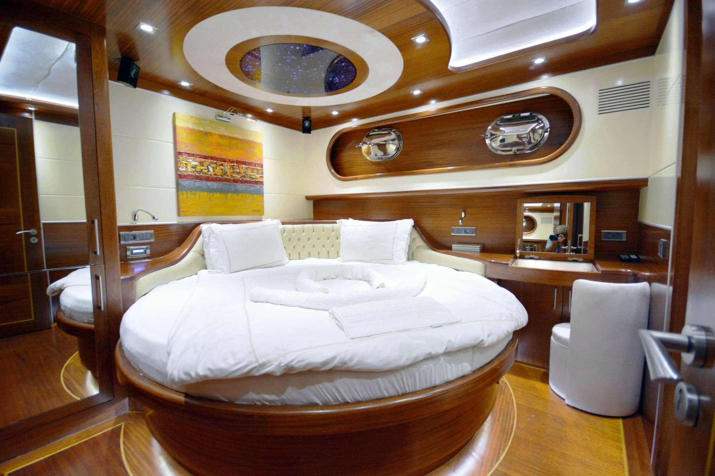 a bed in a room aboard DOLCE MARE Yacht for Charter