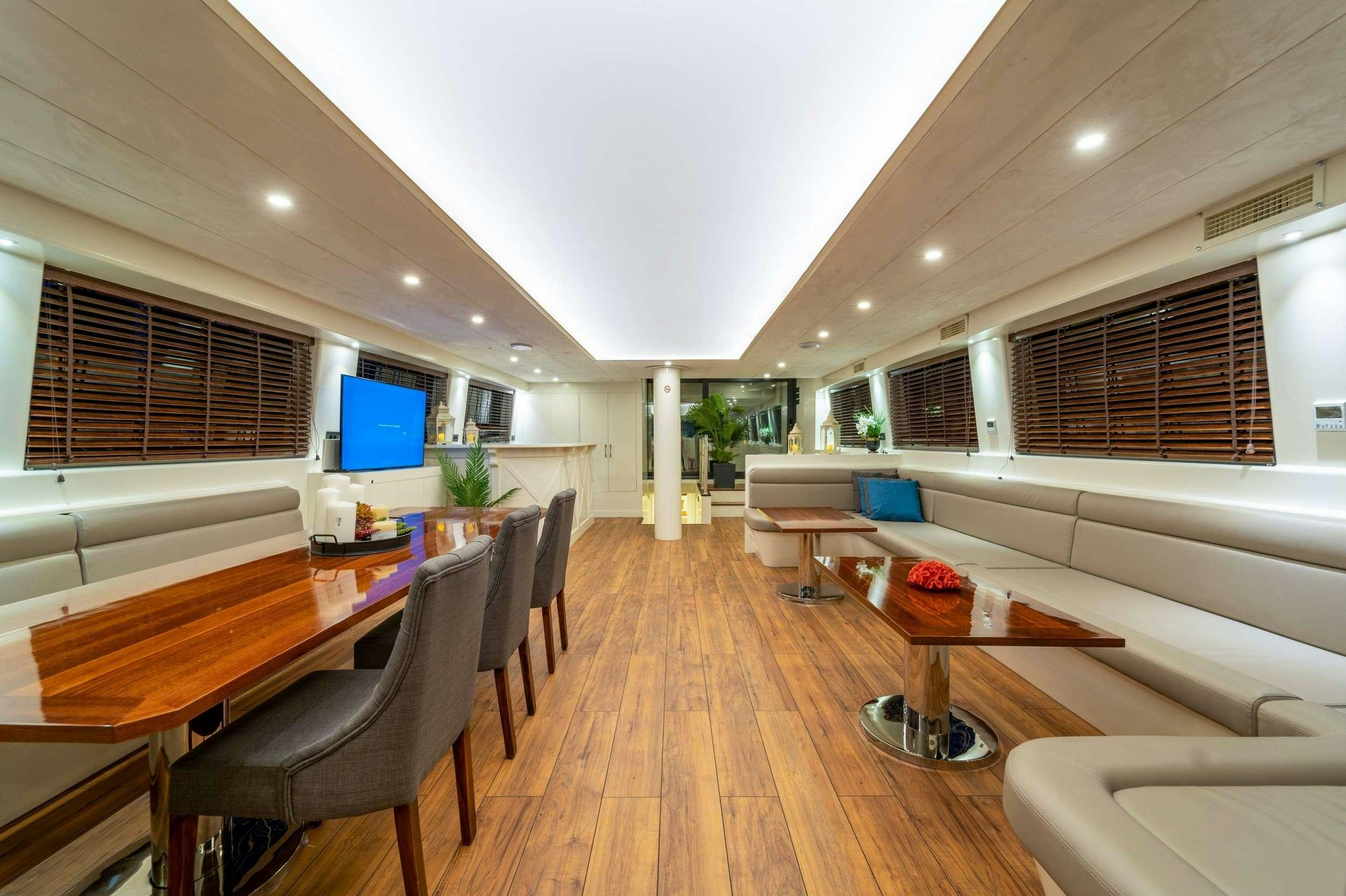 a living room with a wood floor aboard QUEEN OF MAKRI Yacht for Charter