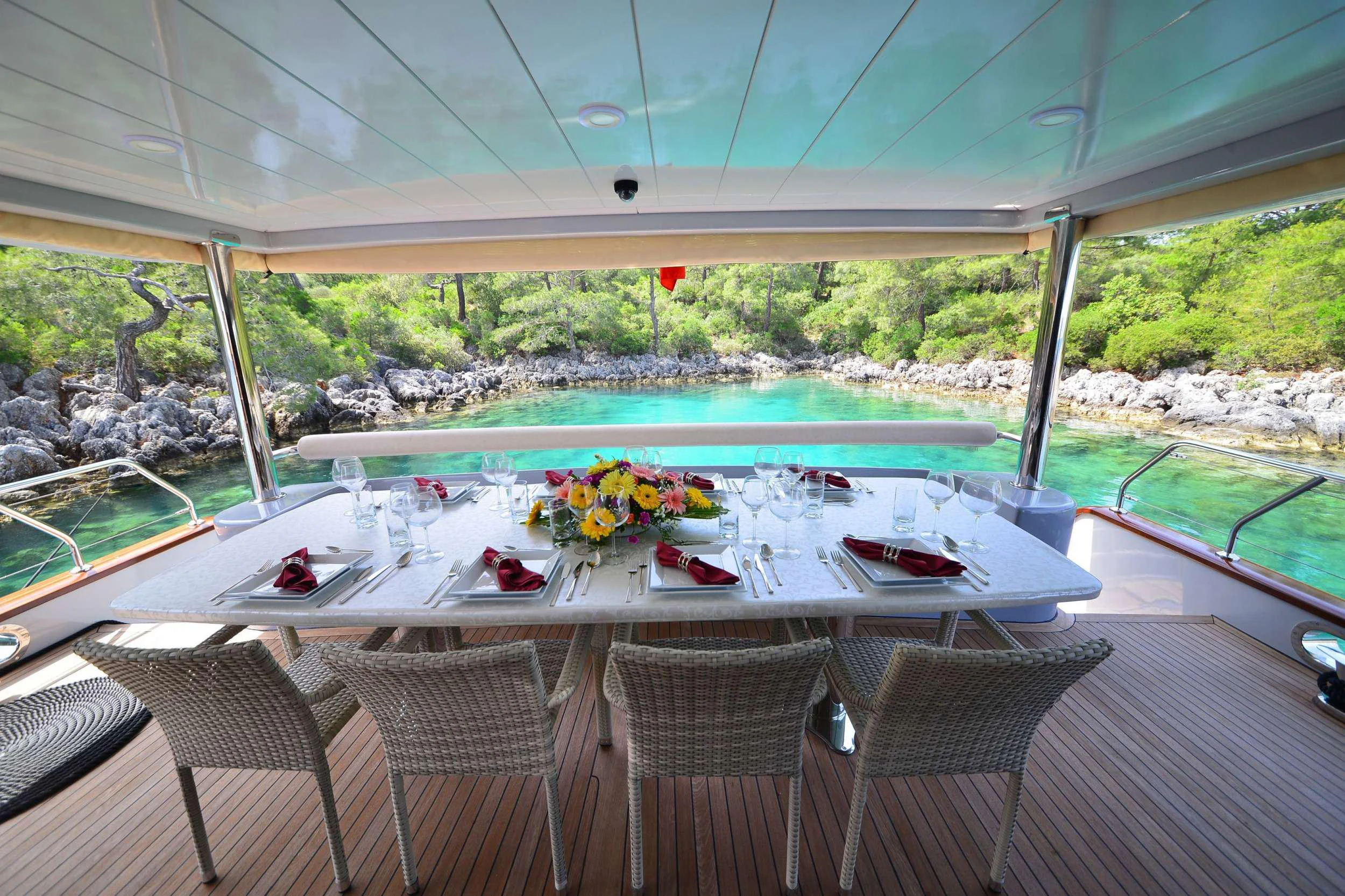 a table set for a meal aboard IMMERSIVE Yacht for Charter