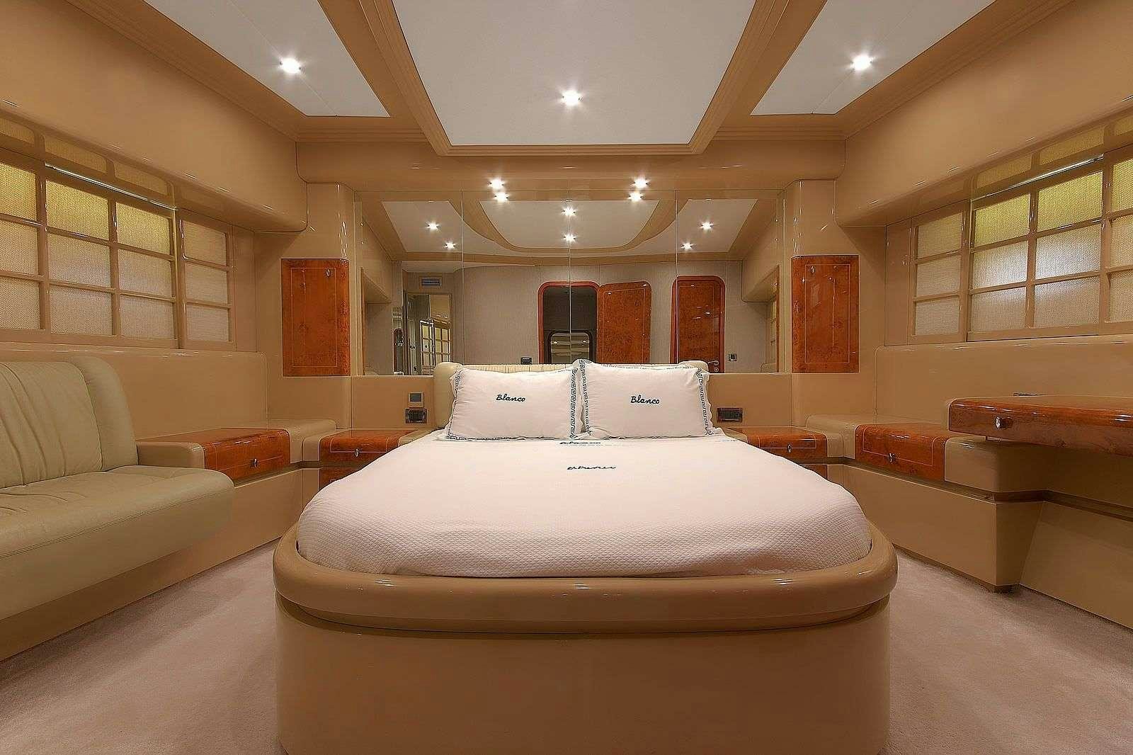 a large room with couches and a table aboard BLANCO Yacht for Charter