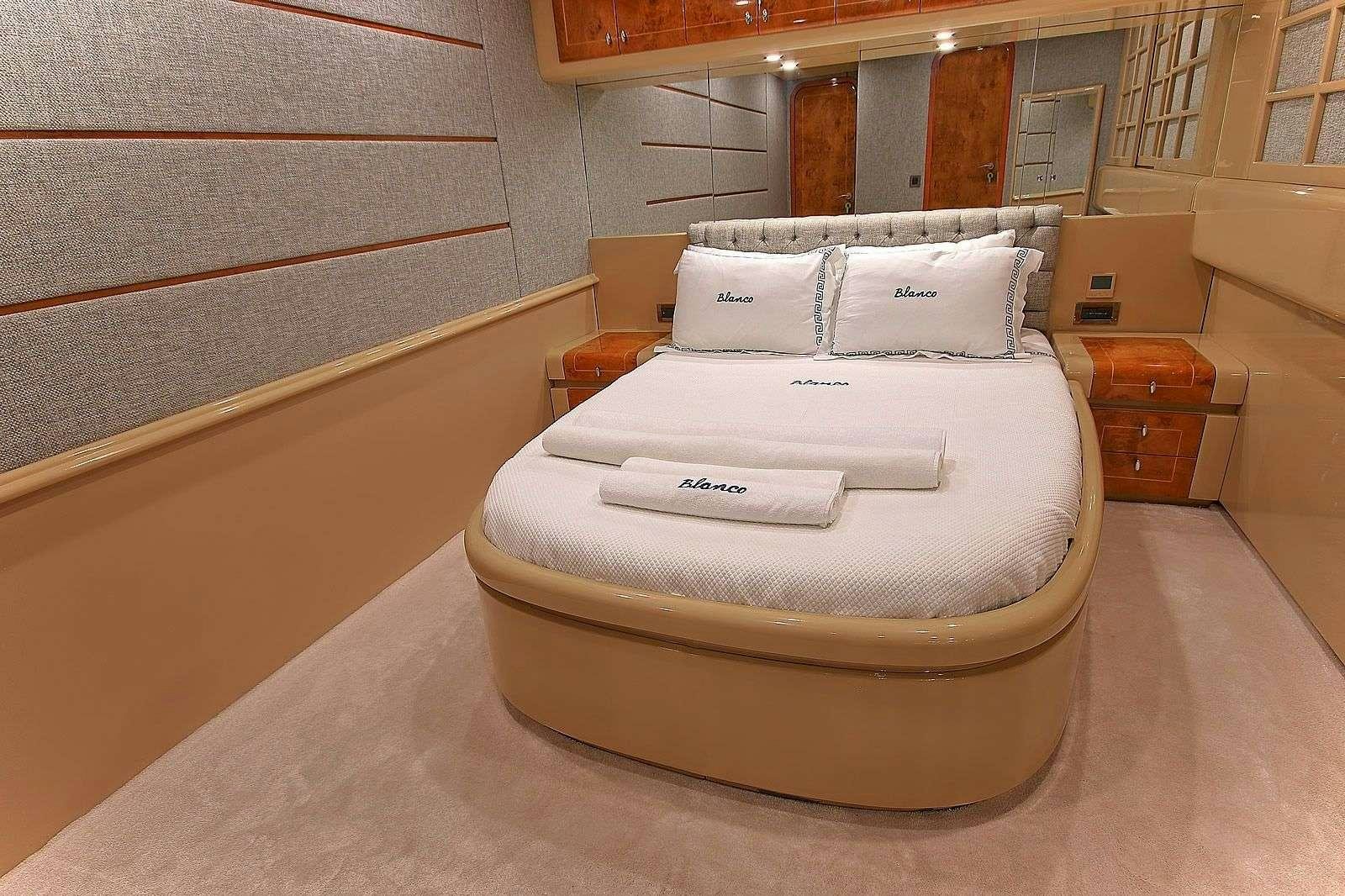 a bed in a room aboard BLANCO Yacht for Charter