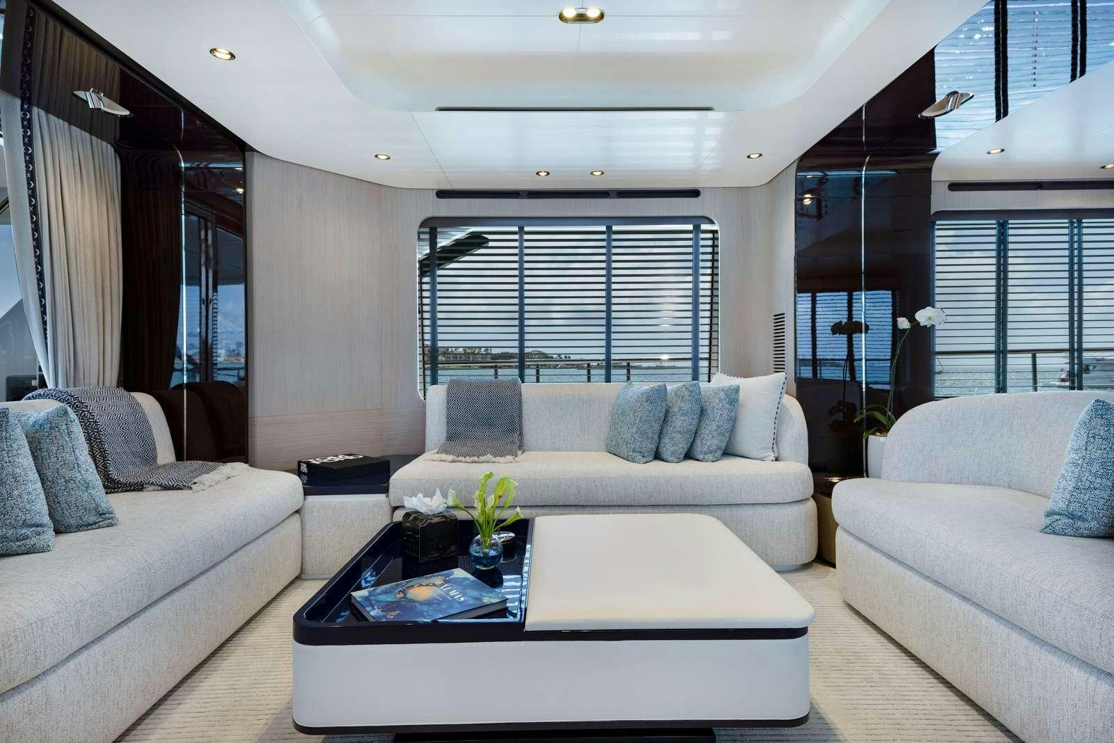 a living room with a couch and a coffee table aboard RINA Yacht for Charter