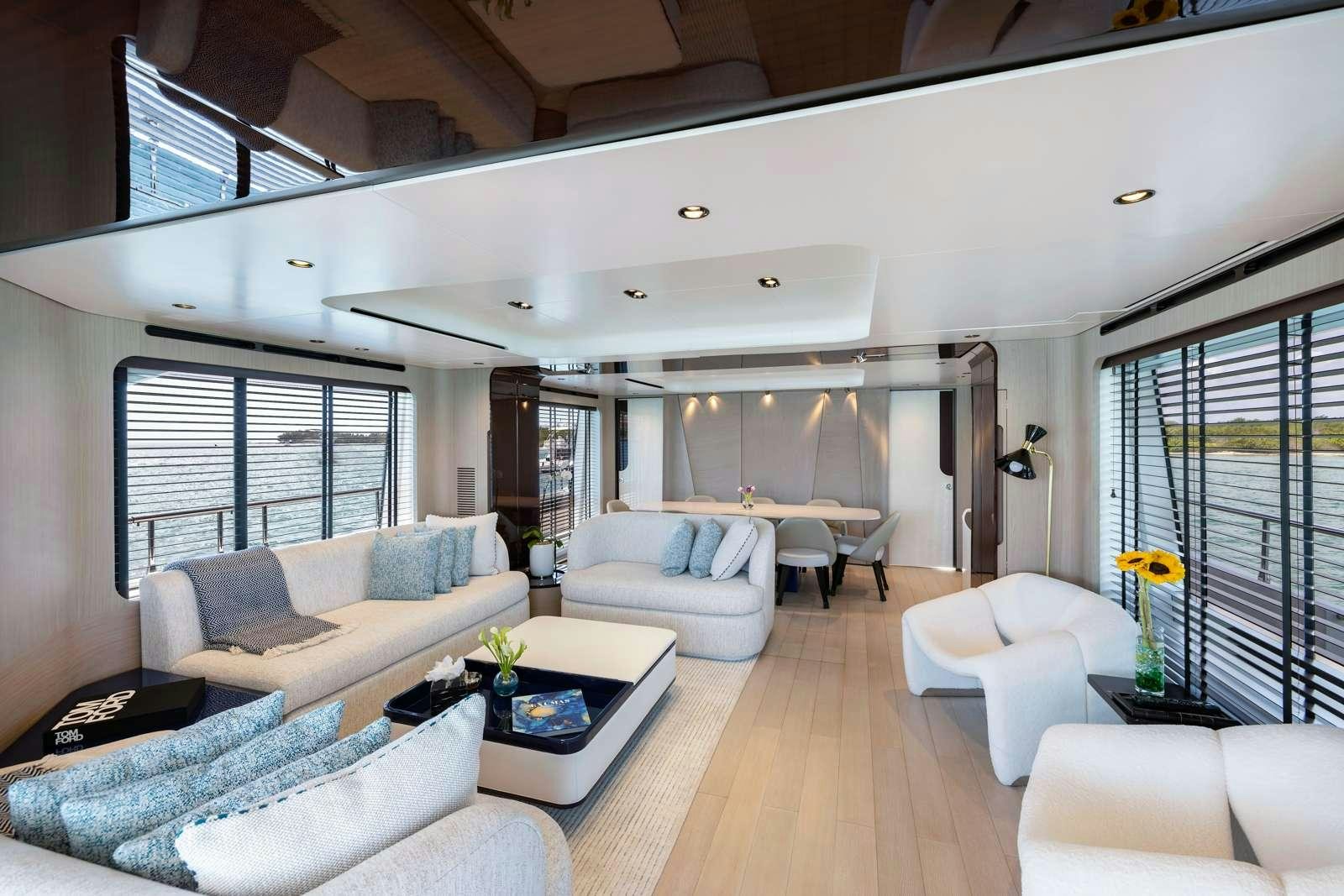 a living room with a large window aboard RINA Yacht for Charter