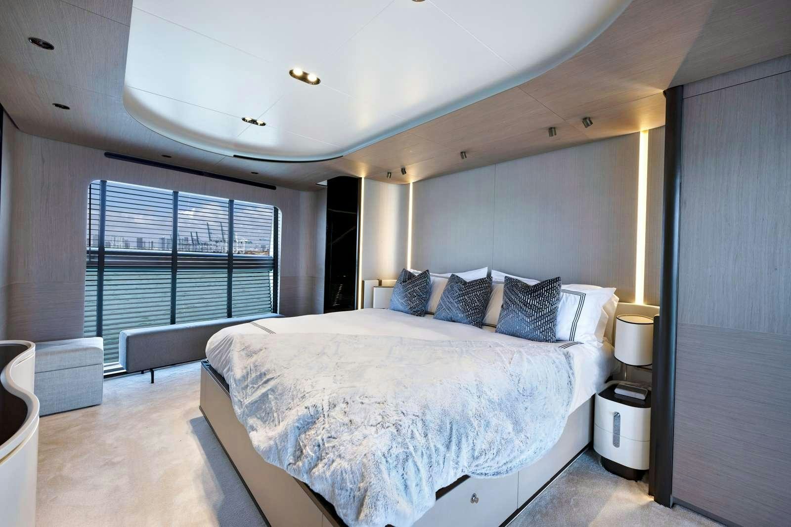 a large bedroom with a large bed aboard RINA Yacht for Charter