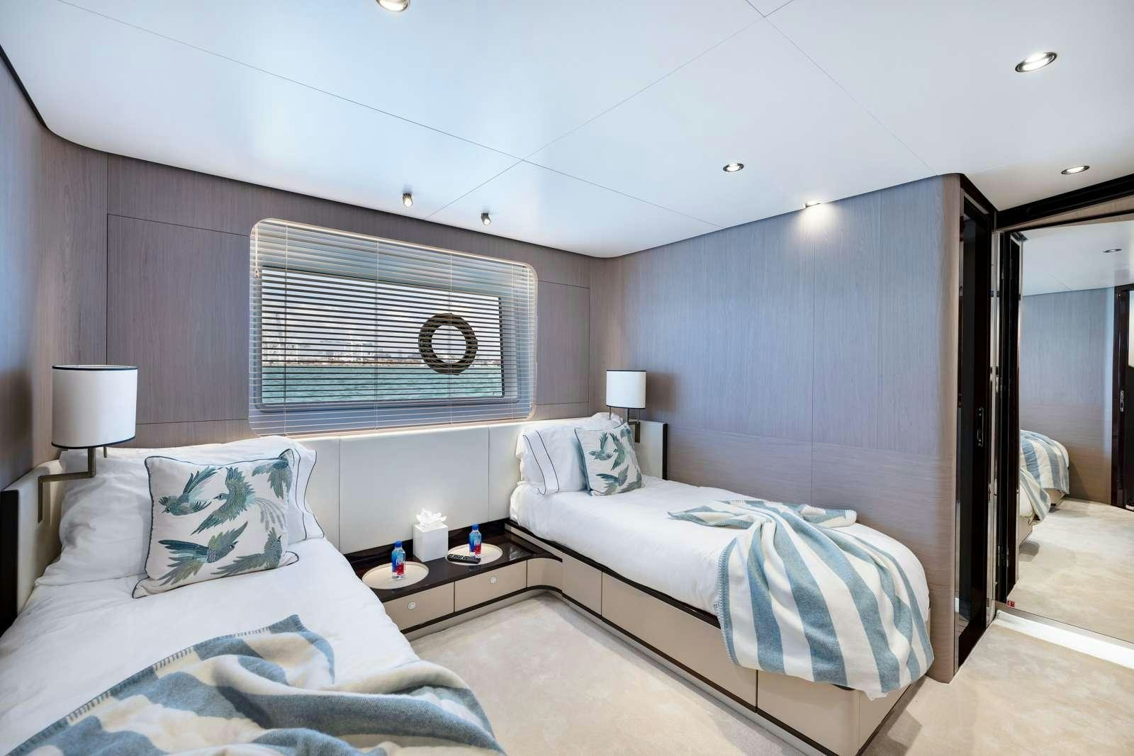 a bedroom with two beds aboard RINA Yacht for Charter