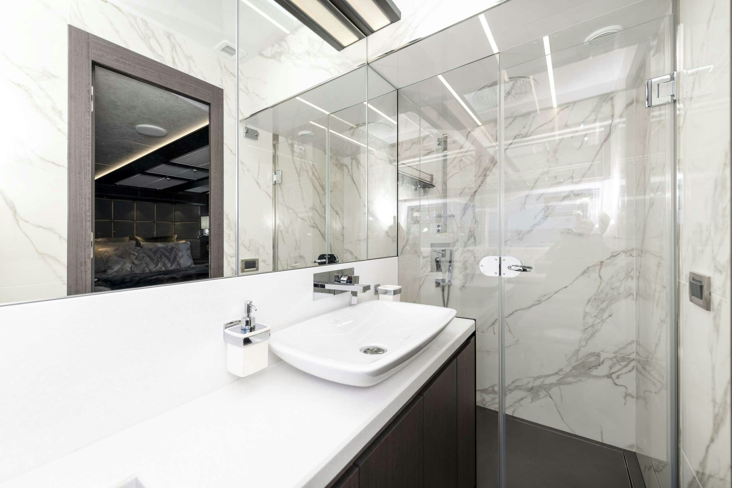 a bathroom with a large mirror aboard CRYPTO LIFE Yacht for Charter
