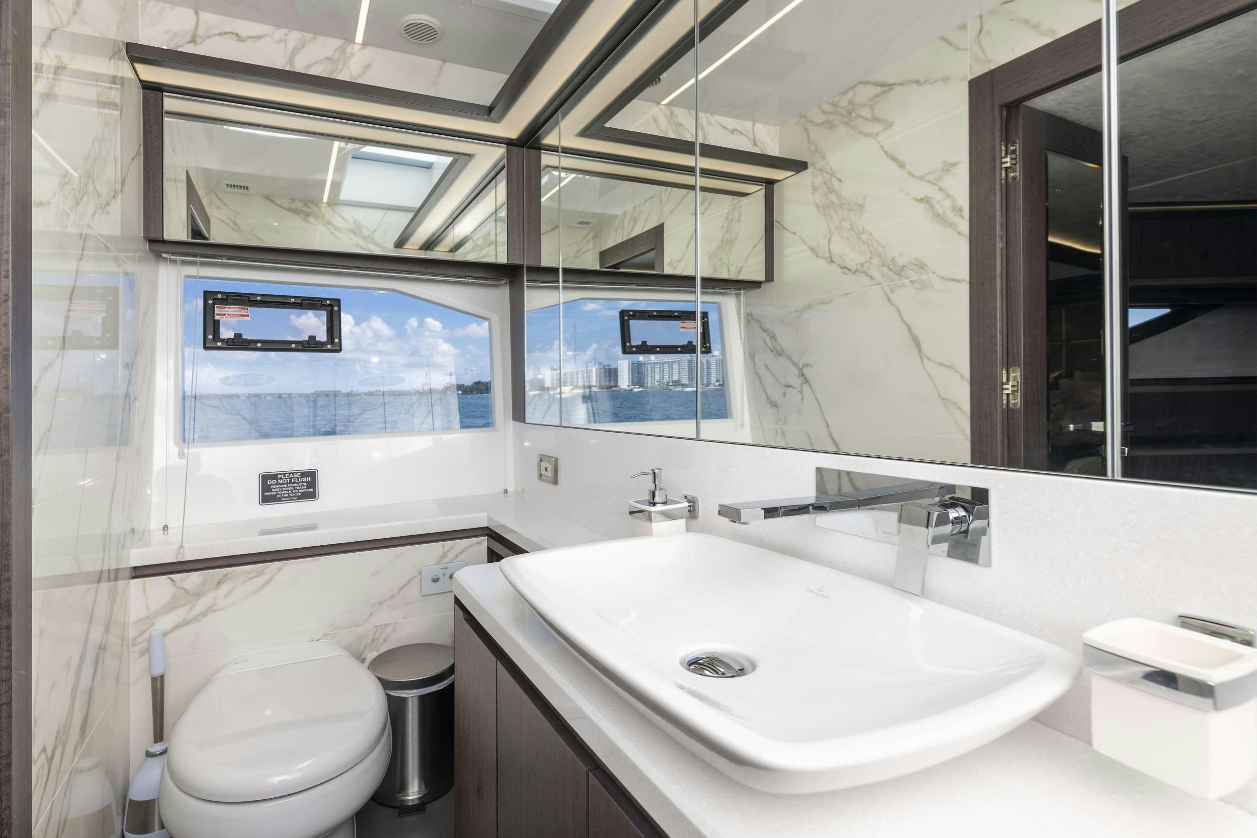 a bathroom with a sink and a toilet aboard CRYPTO LIFE Yacht for Charter