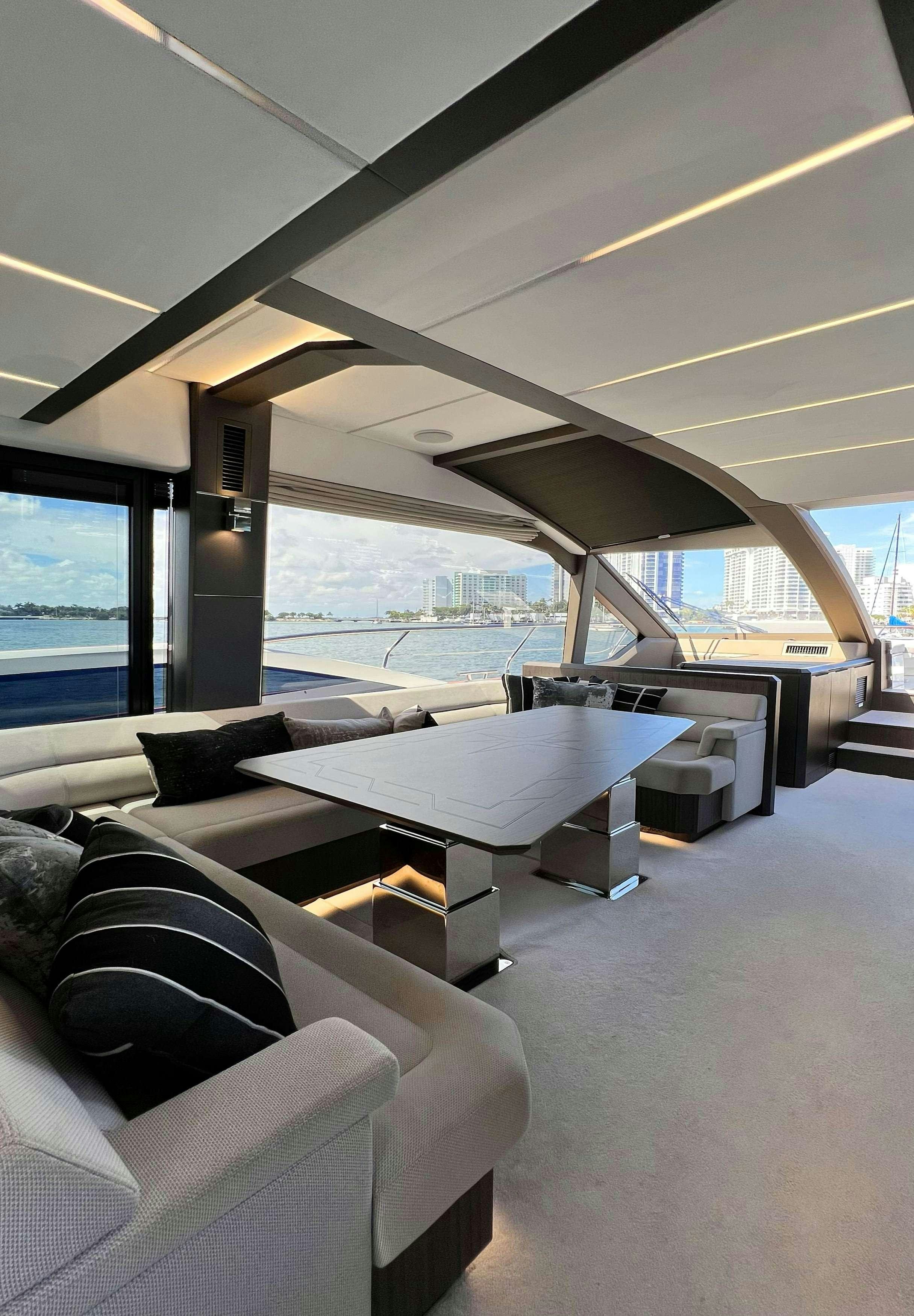 a room with a bed and a couch aboard CRYPTO LIFE Yacht for Charter