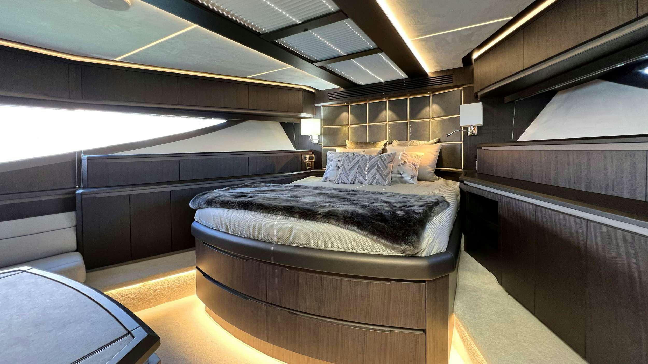 a room with a bed and a desk aboard CRYPTO LIFE Yacht for Charter