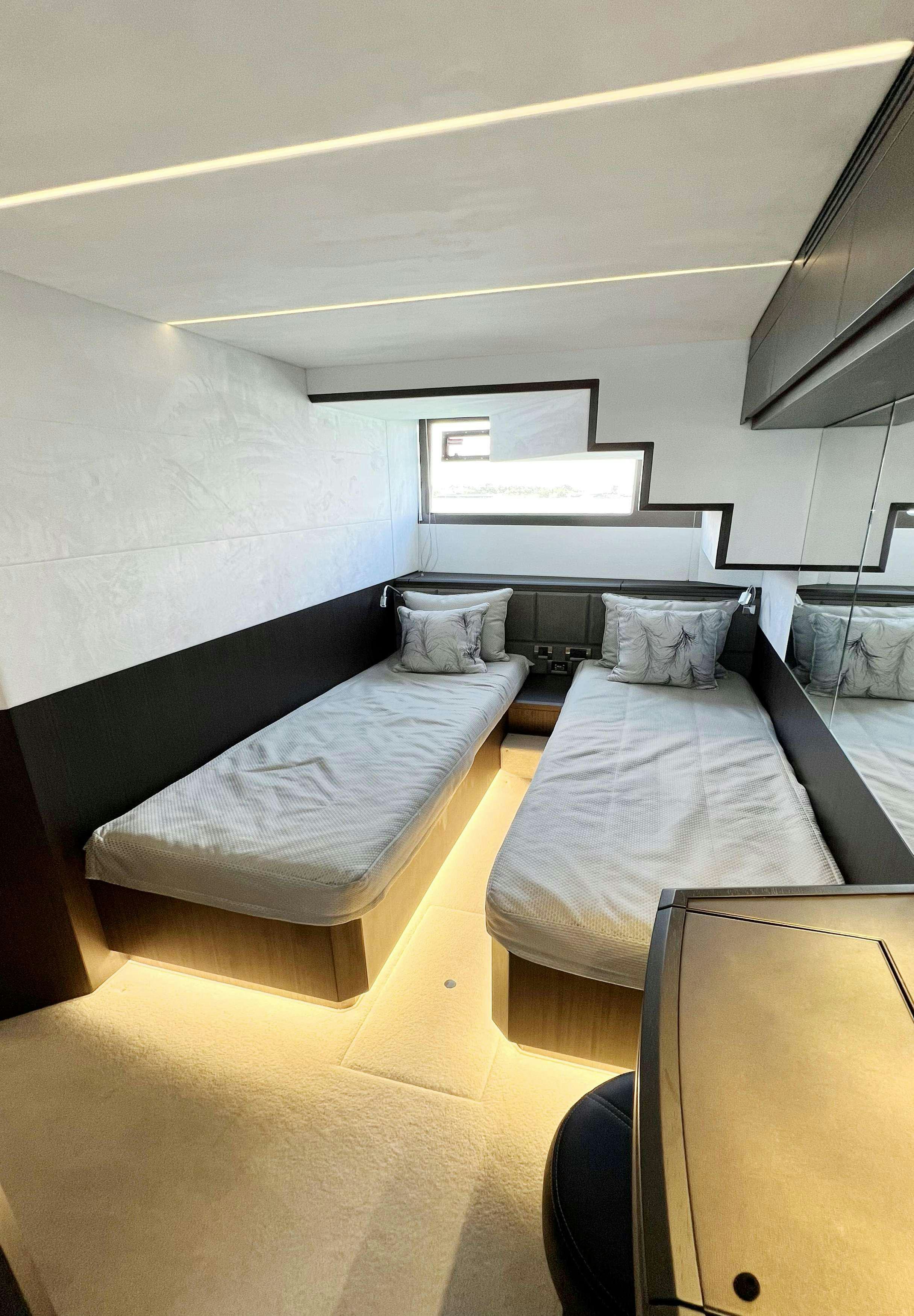 a couple of beds in a room aboard CRYPTO LIFE Yacht for Charter