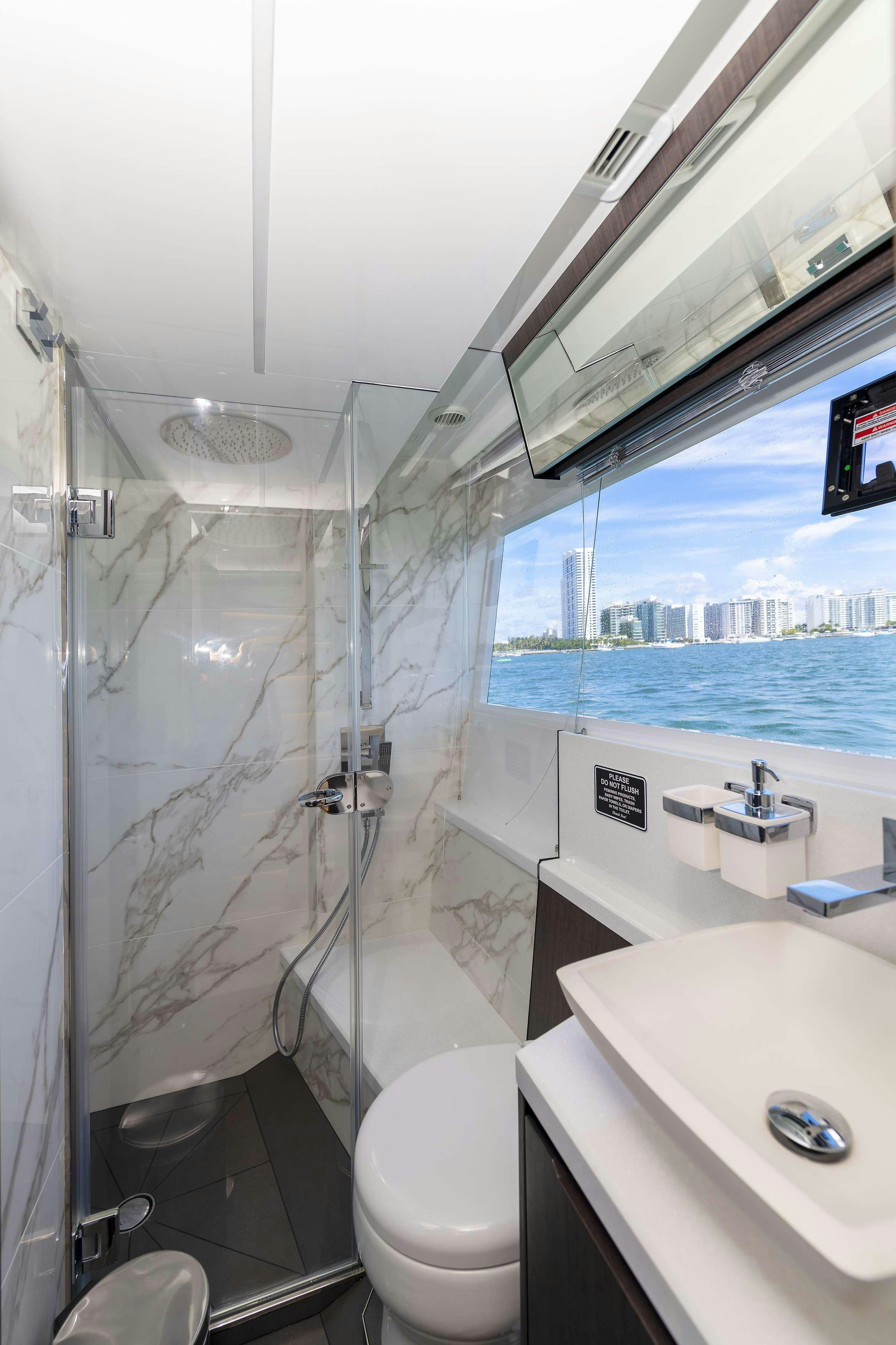 a bathroom with a shower and sink aboard CRYPTO LIFE Yacht for Charter