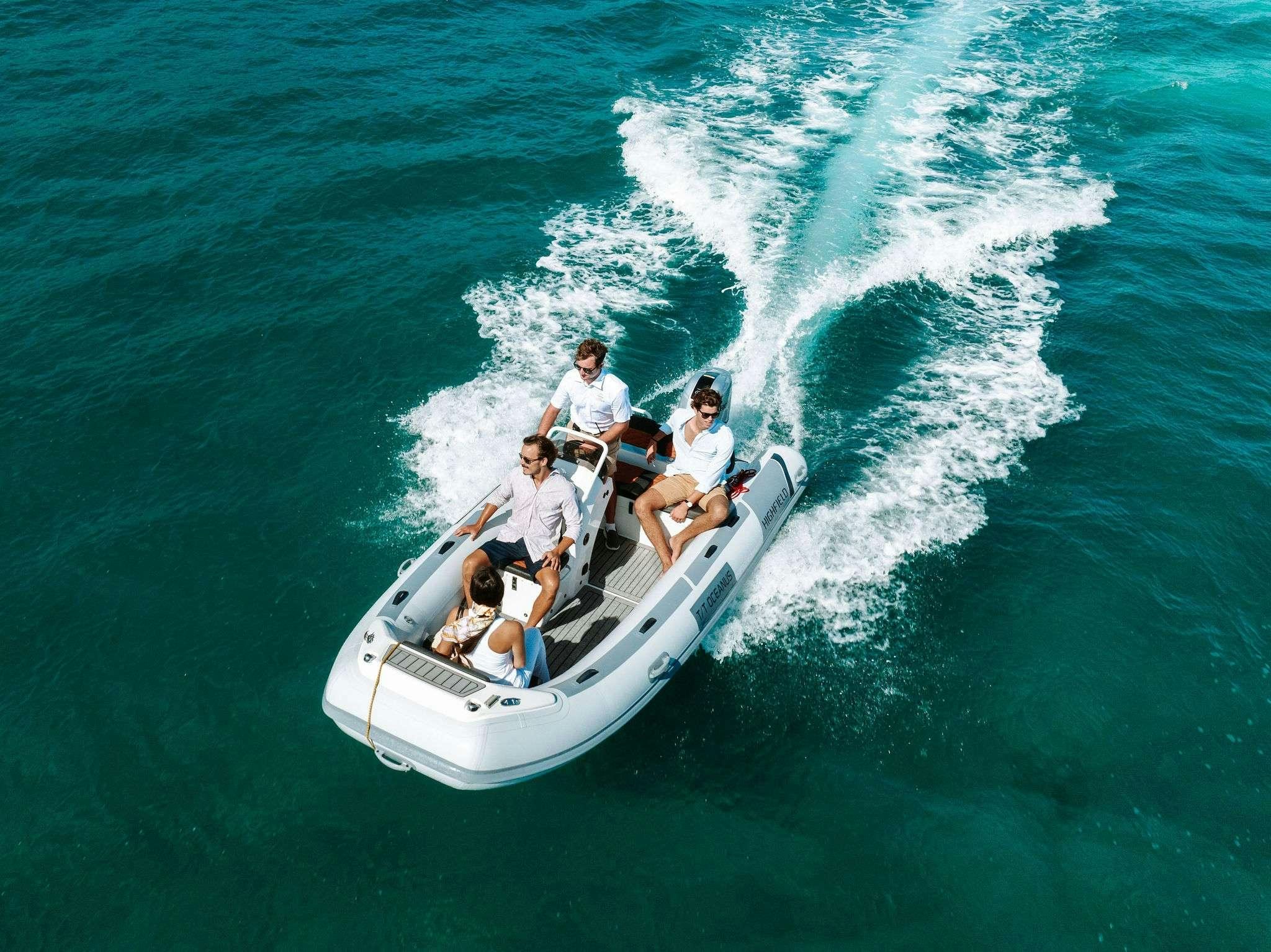 a group of people on a boat aboard OCEANUS Yacht for Charter