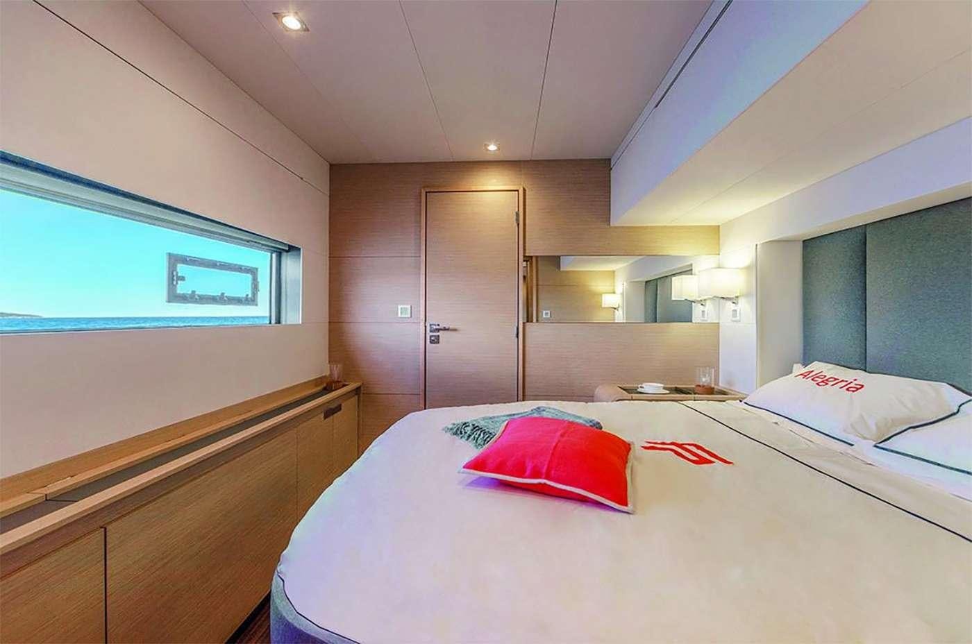 a hotel room with a bed aboard OCEANUS Yacht for Charter
