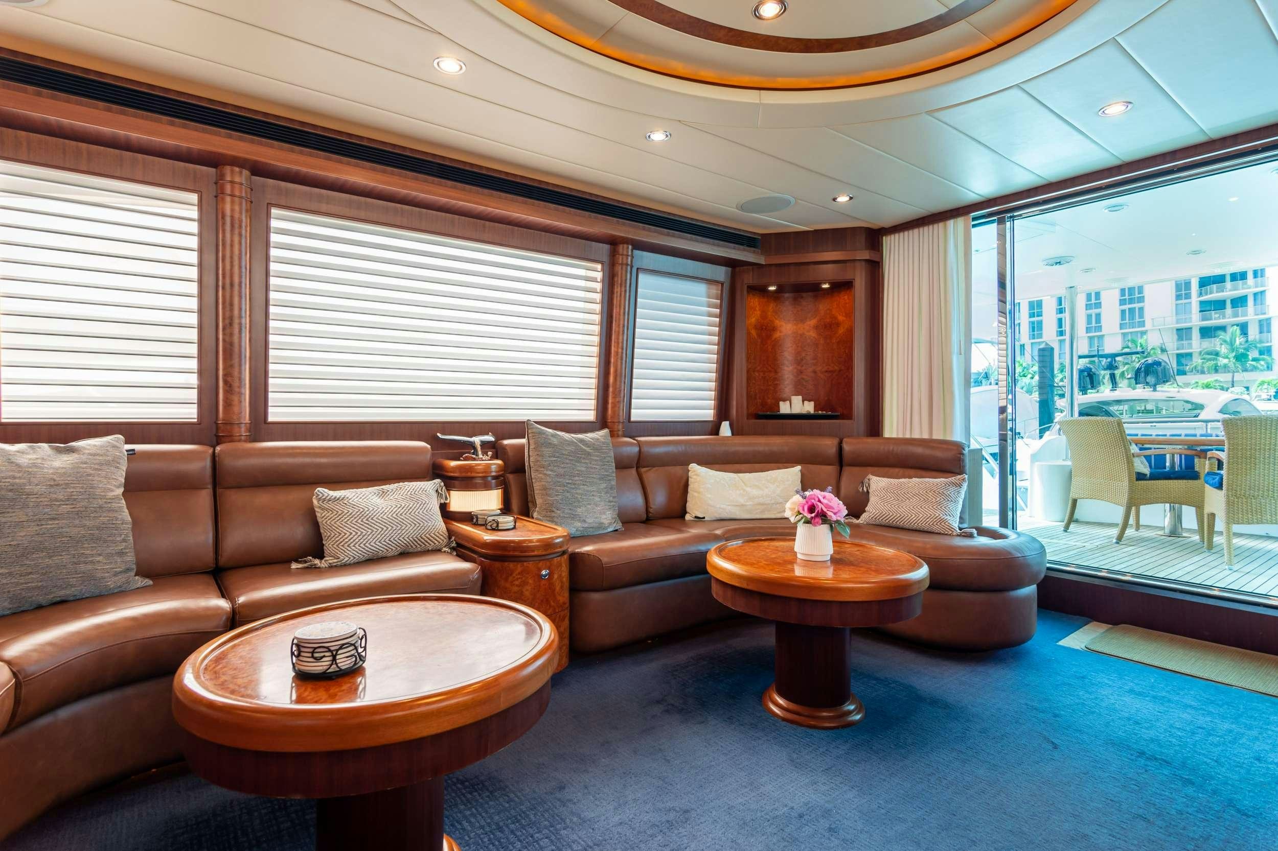 a living room with a couch and a coffee table aboard VIAGGIO Yacht for Charter