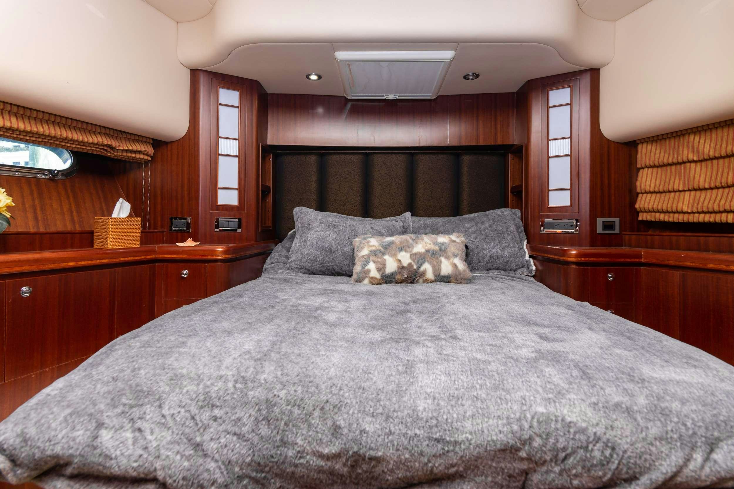 a bed with a pillow aboard VIAGGIO Yacht for Charter