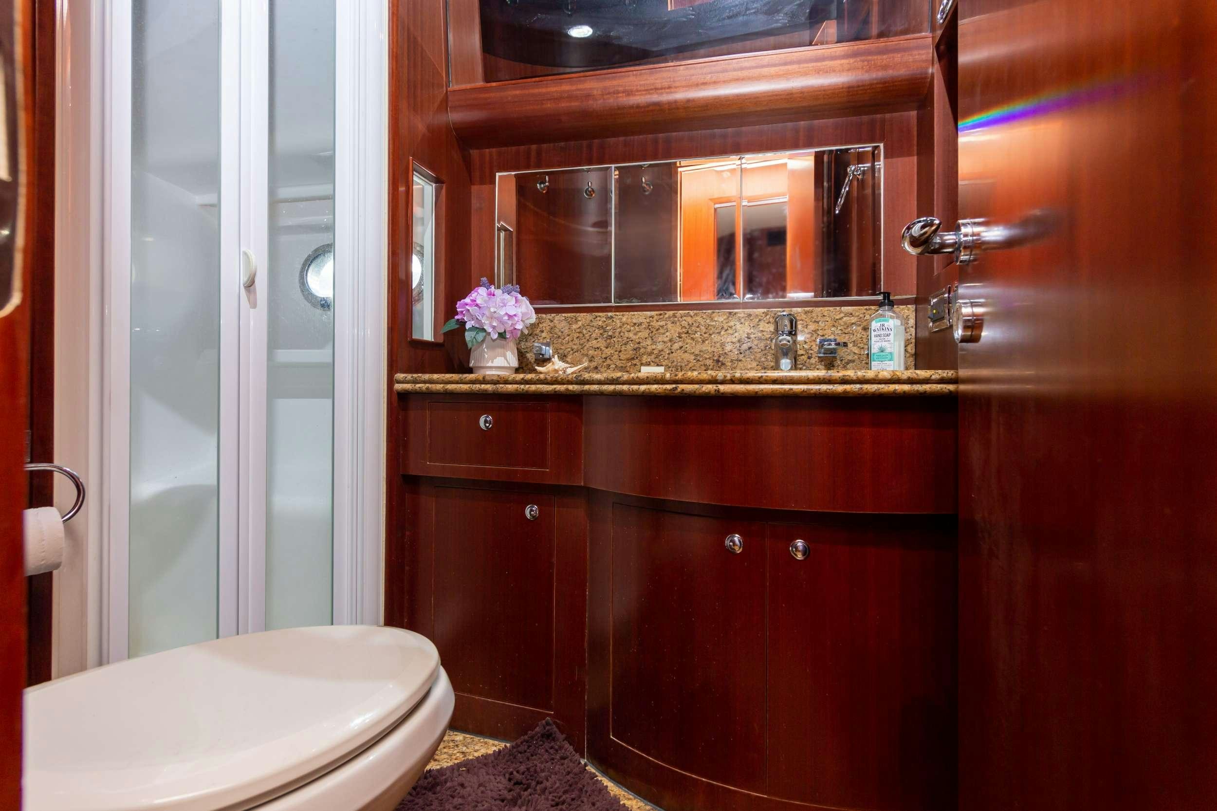 a bathroom with a sink and toilet aboard VIAGGIO Yacht for Charter