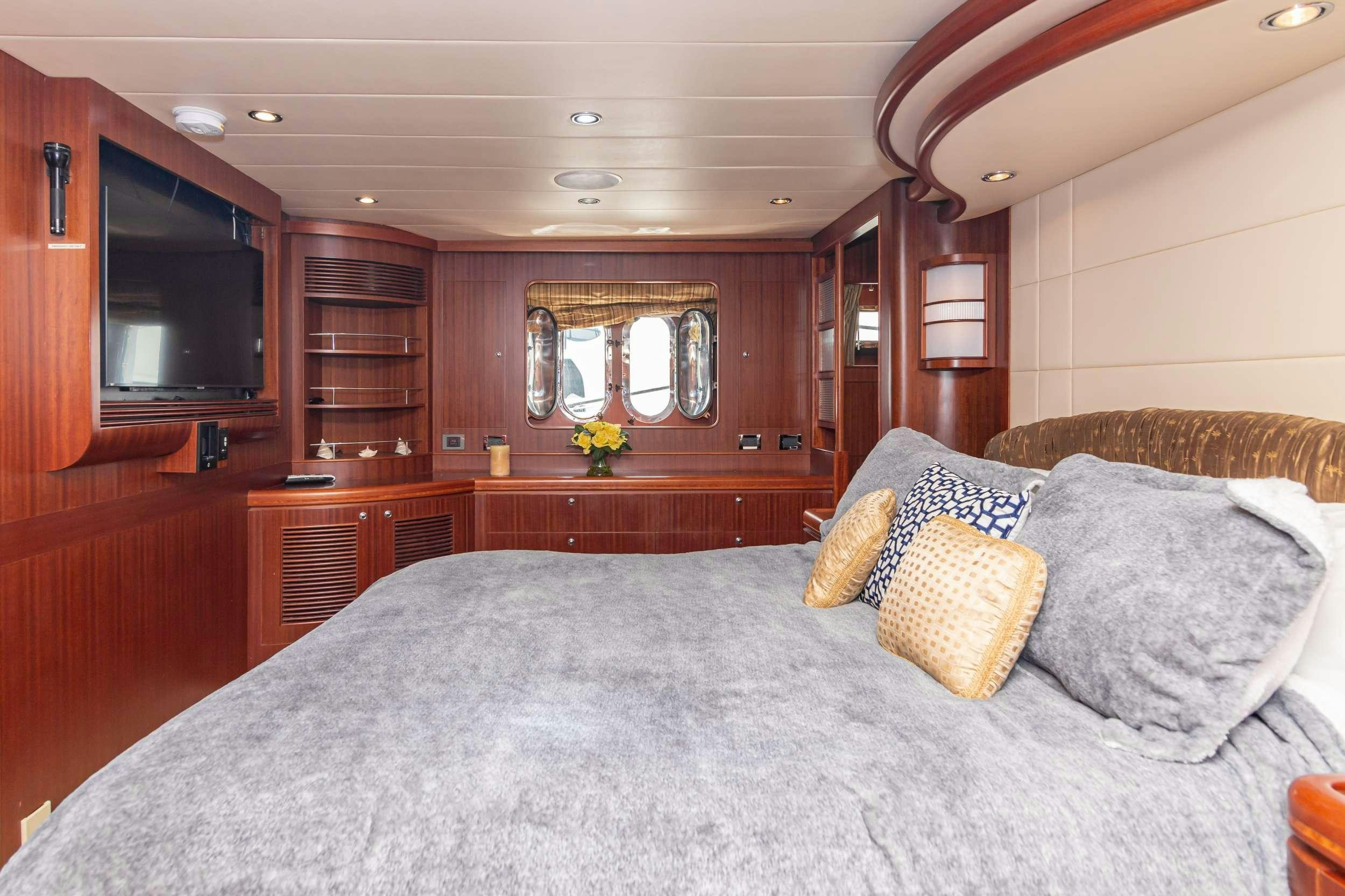 a bed with pillows aboard VIAGGIO Yacht for Charter