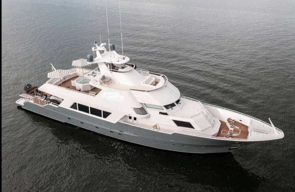 a white yacht in the water aboard 105' POOLE Yacht for Charter