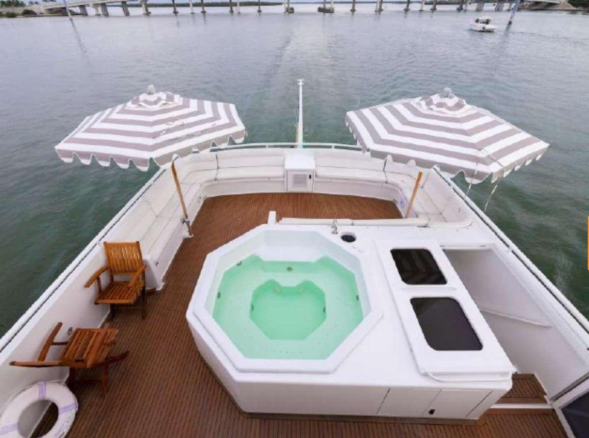 a boat on the water aboard 105' POOLE Yacht for Charter