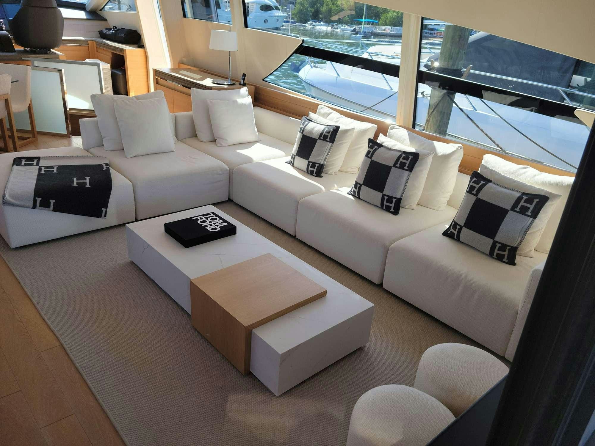a living room with a large window aboard 92 PERSHING Yacht for Charter