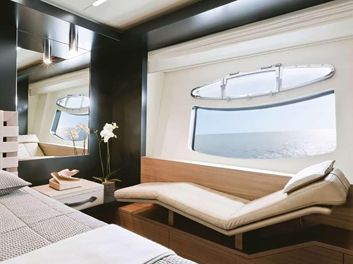 a room with a bed and a window aboard 92 PERSHING Yacht for Charter