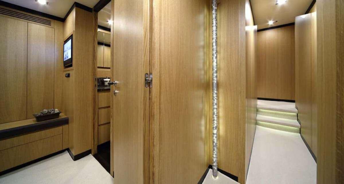 a room with wooden cabinets aboard BLUE HEAVEN 2 Yacht for Charter