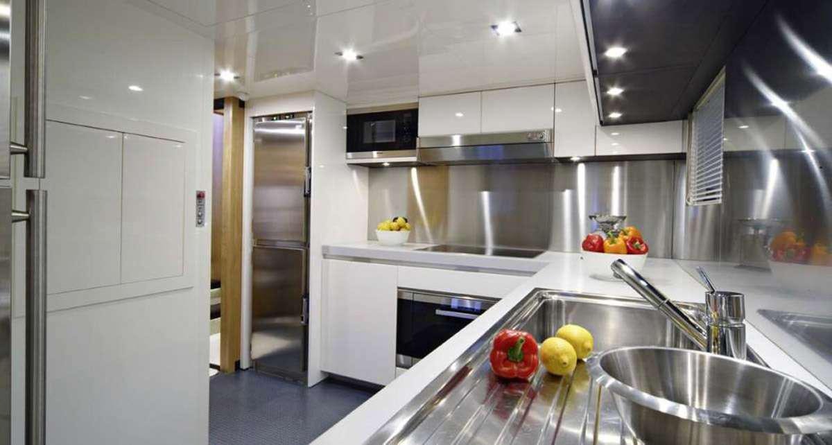 a kitchen with a sink and a microwave aboard BLUE HEAVEN 2 Yacht for Charter
