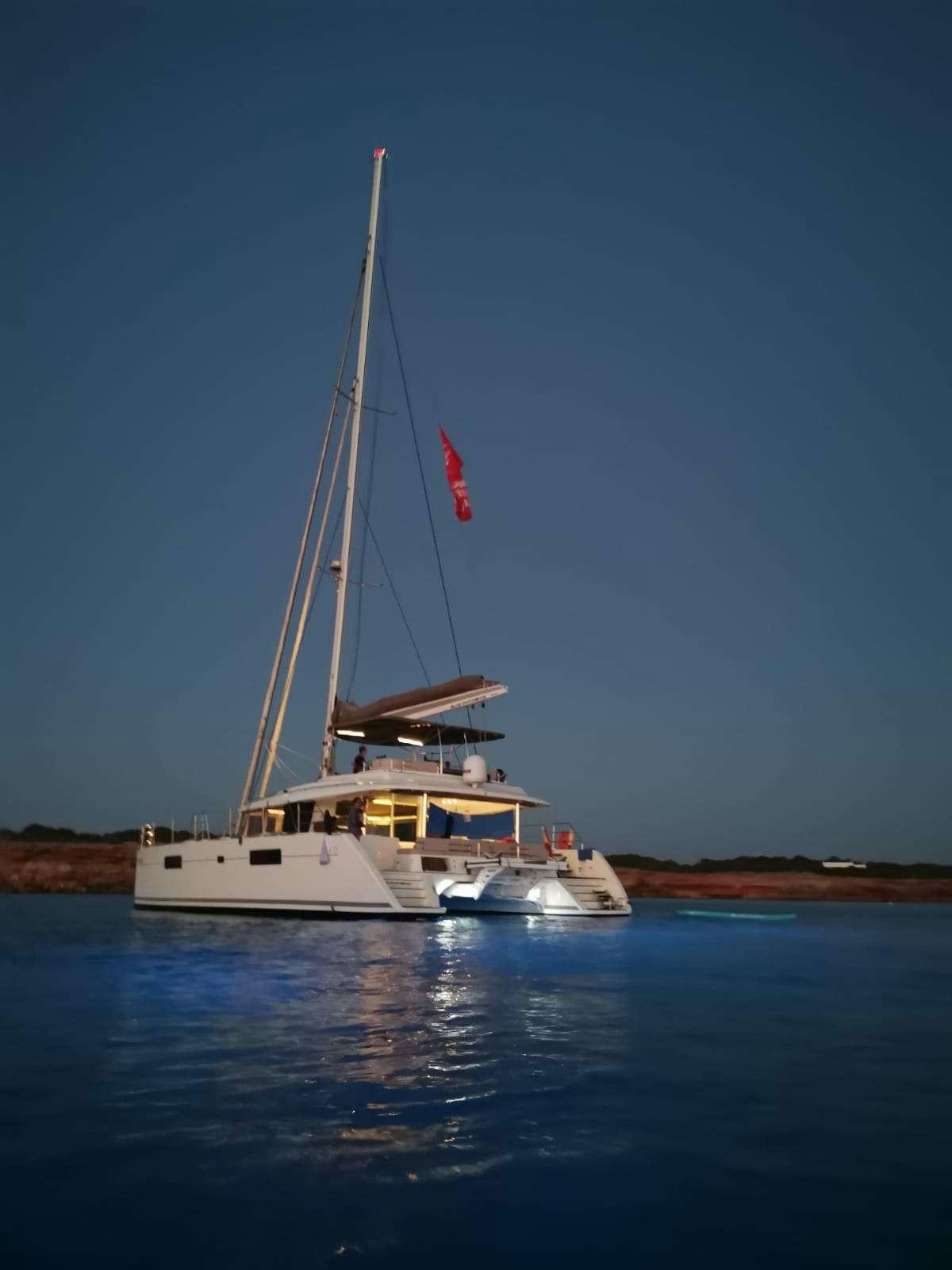 a boat sailing on the water aboard ISLAS CHAFARINAS  Yacht for Charter