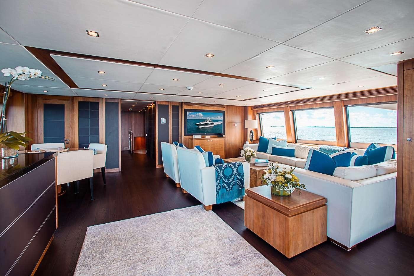 a large living room with a large window aboard ACACIA Yacht for Charter