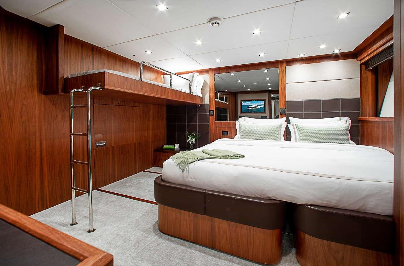 a room with a bed and a ladder aboard ACACIA Yacht for Charter