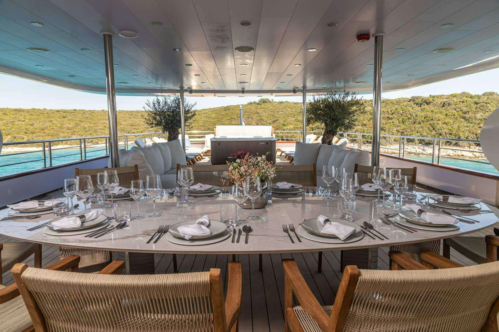 a table set for a dinner aboard OLIMP Yacht for Charter